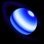 Against a black background, Saturn appears as a blue-and-white banded body encircled by a faint, deep blue system of rings.