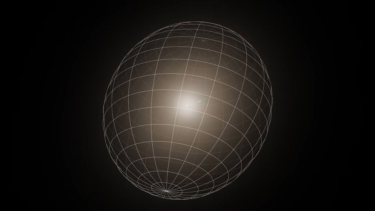 A 36-second animation that begins with a Hubble photo of the galaxy M87. The galaxy resembles a translucent, fuzzy white cotton ball. The brightness decreases gradually out in all directions from a bright point of light at the center. A wavy, blue jet of material extends from the core outward to the upper right, about halfway across the galaxy. Stars speckle the background. About 3 seconds in, the image transitions to a simulated image of the same galaxy, without any background stars. An egg-shaped grid of lines whose long axis is oriented from lower left to upper right appears and immediately begins rotating counterclockwise. The galaxy rotates with the grid, changing appearance as the orientation changes and different parts of the galaxy move in and out of view. At the end, the grid fades away, leaving the simulated galaxy.