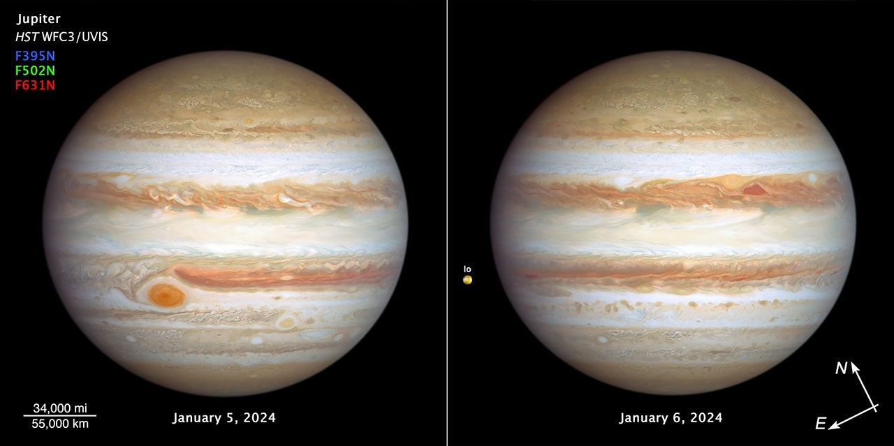 A side-by-side image titled "Jupiter HST/WFC3/UVIS" shows opposite faces of Jupiter banded in brownish orange, light gray, soft yellow, and shades of cream stripes, on the black background of space. Below the title is a color key with filters and colors used to create the images: "F395N" blue; "F502N" green, and "F631N" red. At bottom center is the label "January 5, 2024." At left is scale bar “34,000 mi over 55,000 km." Many large storms and white clouds punctuate the planet—The Great Red Spot is in the left bottom third of this view. On the right-hand image, centered at the bottom is the label "January 6, 2024." To the bottom right are compass arrows indicating the orientation on the sky. The north arrow points towards 11 o'clock; the east arrow points toward 8 o'clock. On this side of the planet, at upper right center, a pair of storms appear next to each other: a deep-red, triangle-shaped cyclone and a reddish anticyclone. Toward the far-left edge of the image is Jupiter's tiny orange-colored moon Io.