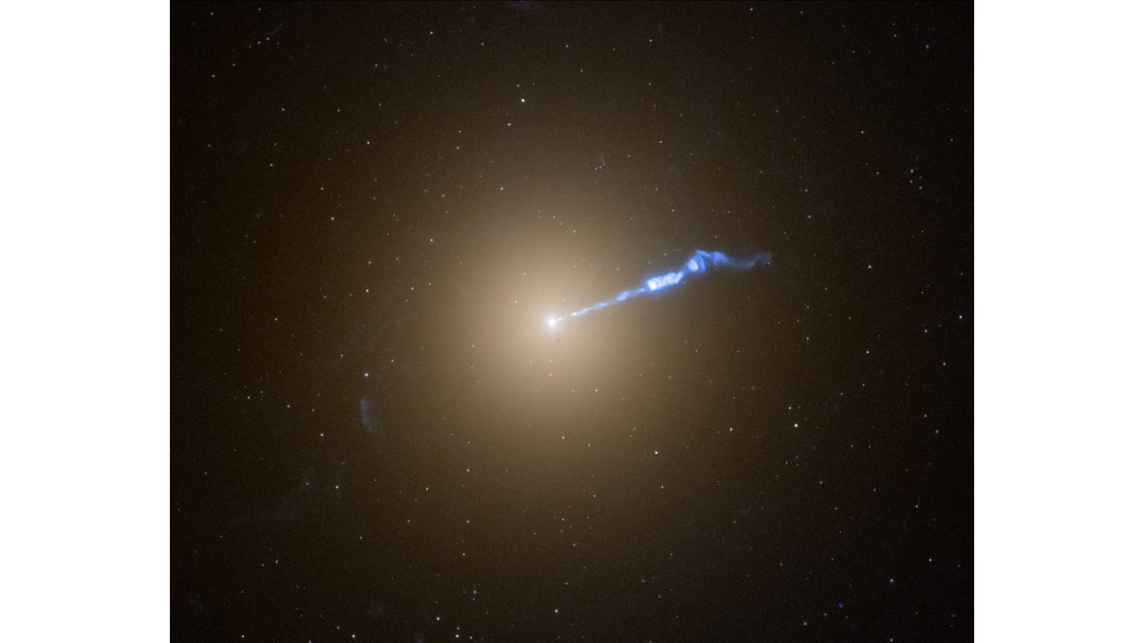 This video plots the location of Hubble Space Telescope observations of novae – exploding stars – in the giant elliptical galaxy M87 that appears as a white spherical blob on the black background of space. The galaxy’s most notable feature is a 3,000-light-year-long jet of plasma ejected from a supermassive central black hole. The jet is a blue streak extending diagonally from the galaxy to upper right of the frame.