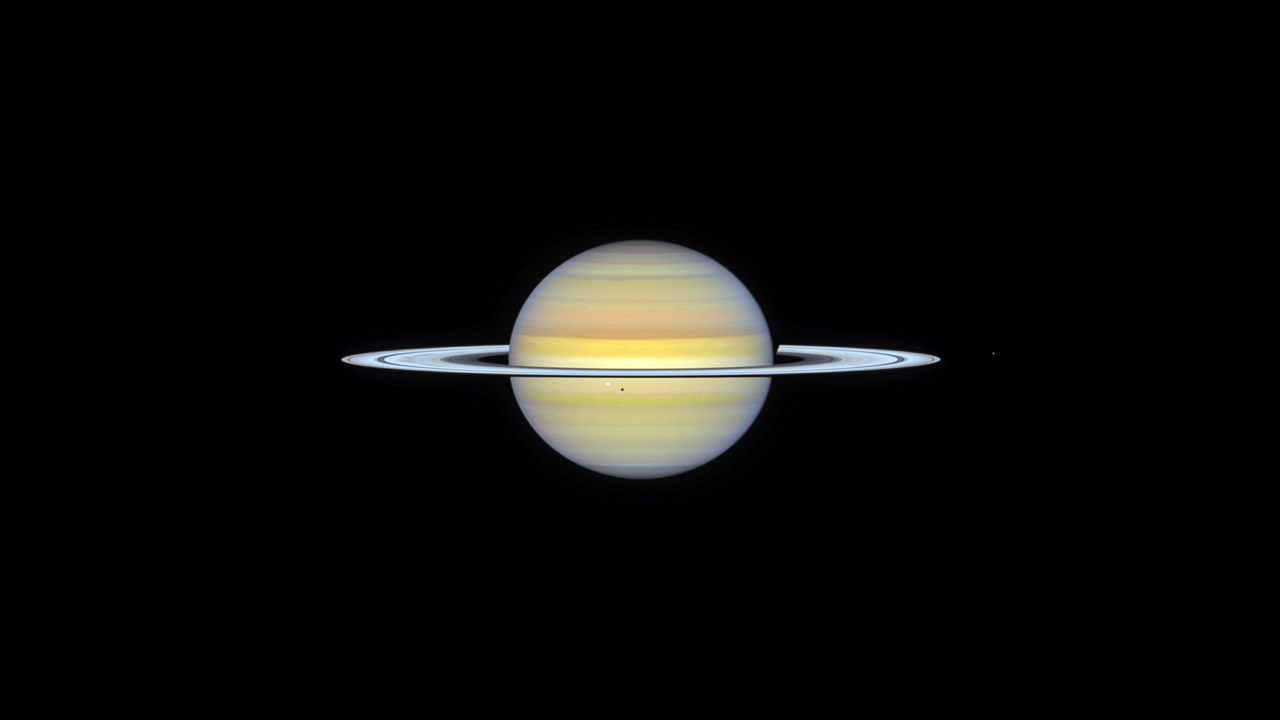 A time-lapse movie of a Hubble Space Telescope set of images taken of Saturn under the OPAL (Outer Planet Atmospheres Legacy) program in August 2024. In the 18 hours of observations several small icy moons are visible in every frame speeding around like race cars: Dione, Enceladus, Janus, Mimas, and Tethys. Their orbits are co-planar with Saturn's magnificent rings. Dusty "spokes" in the rings can also be seen rotating around the planet in this movie.