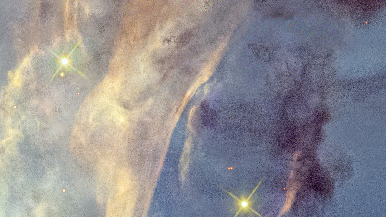 A tiny portion of the Rosette Nebula. At left are broad vertical ribbons in yellow. At right, the background is blueish. Patches of dark material are superimposed. Two prominent yellow stars show four diffraction spikes.