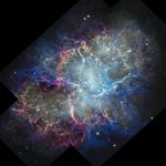 Colorful nebula in space with a white haze throughout that is more concentrated in the center with a rippling effect. Colorful gas filaments appear to splash outward from the nebula center, colored yellow, magenta, and blue. A faint black border with right angles at the corners of the images show where the telescopeu2019s field of view stopsdotted line with right angles shows the borders of the telescopeu2019s image. Small white stars dot the background.