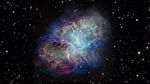 Colorful nebula in space with a white haze throughout that is more concentrated in the center with a rippling effect. Colorful gas filaments appear to splash outward from the nebula center, colored yellow, magenta, and blue. White stars dot the background.
