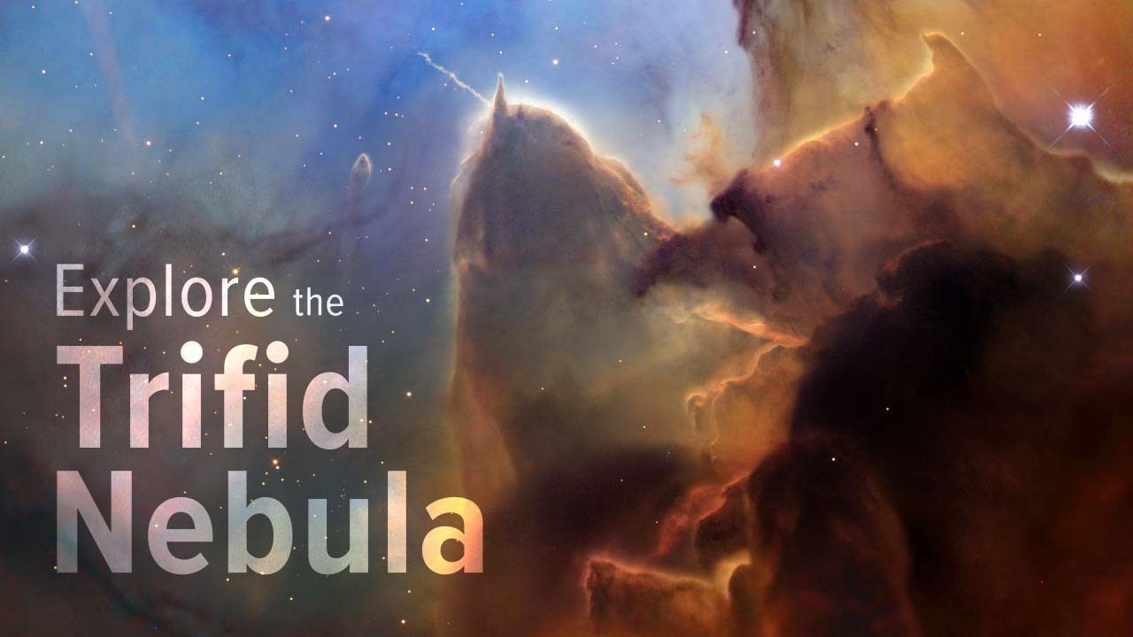 A tightly cropped Hubble view of a vast star-forming region known as the Trifid Nebula. At left, text reads: Explore the Trifid Nebula. The top left is bright blue. Brown and amber colors run from top right through the center. At bottom right, the view is almost black. Tiny, amber-colored stars appear throughout.