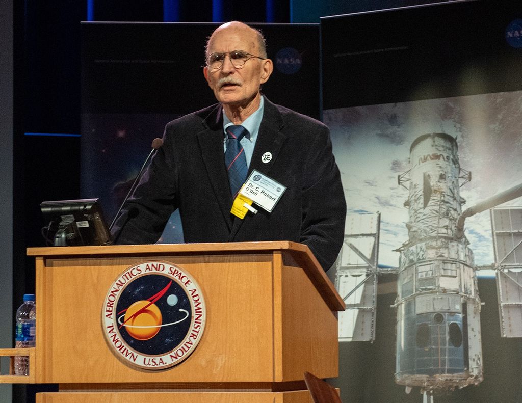 Dr. O'Dell speaks from the NASA podium.