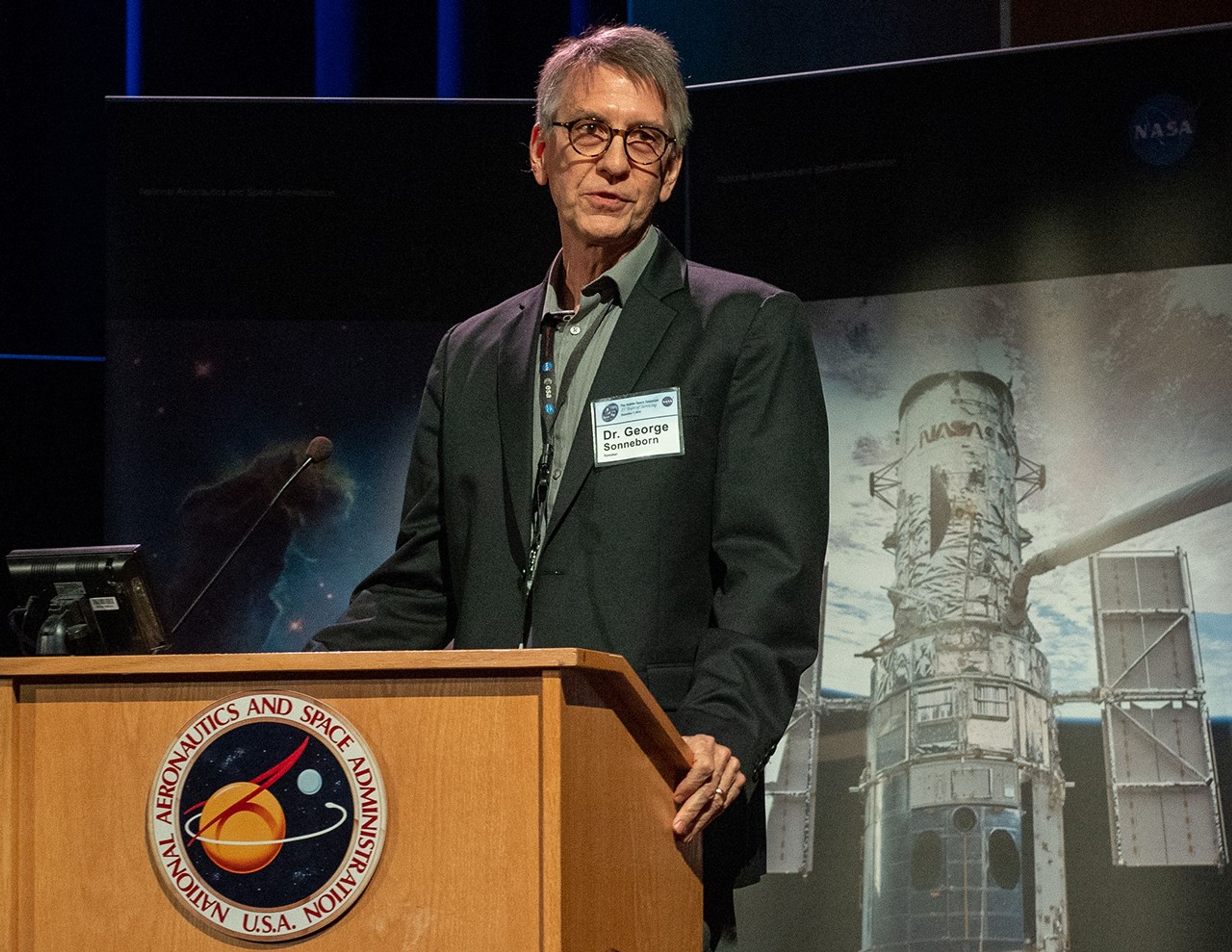 George Sonneborn speaks from the NASA podium.