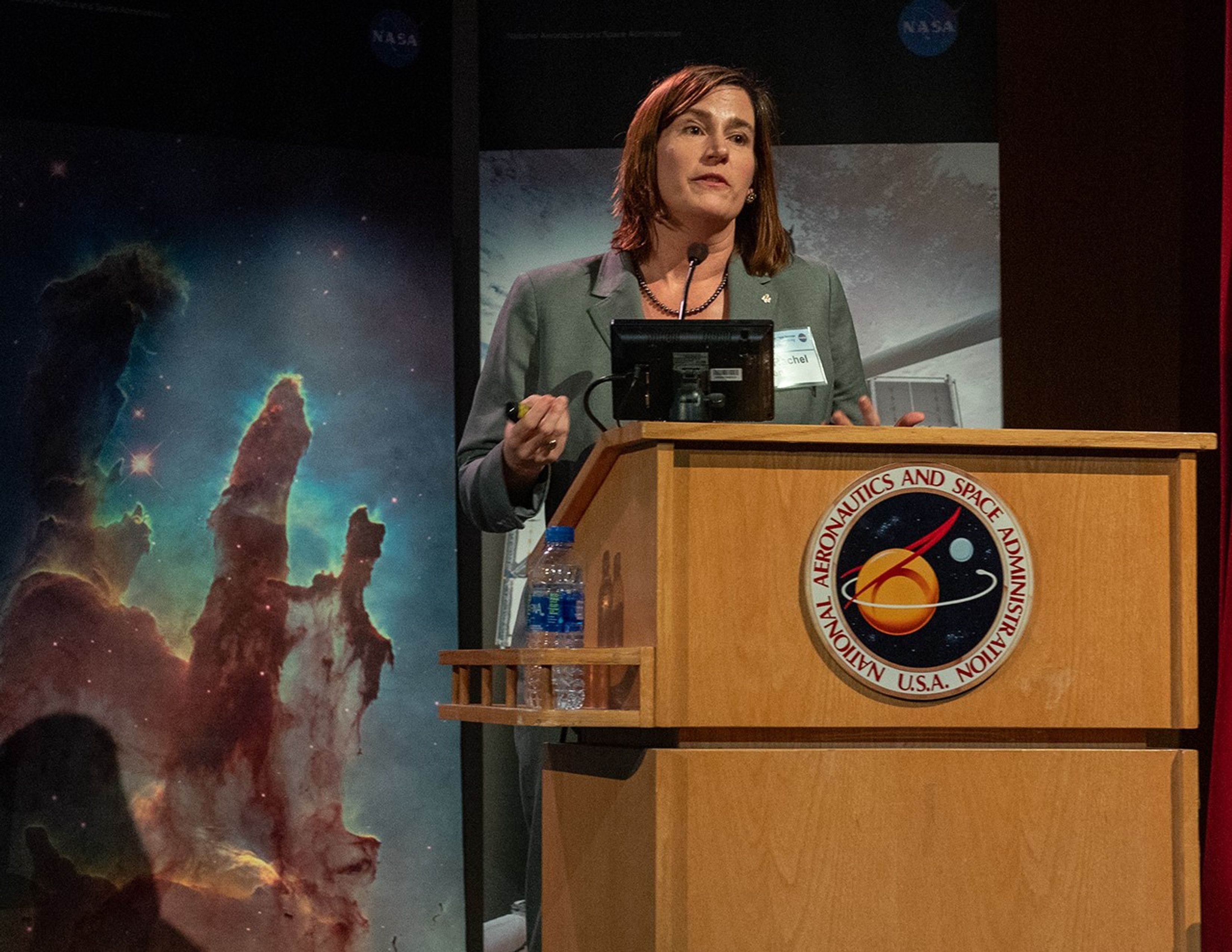Rachel Osten speaks from the NASA podium.