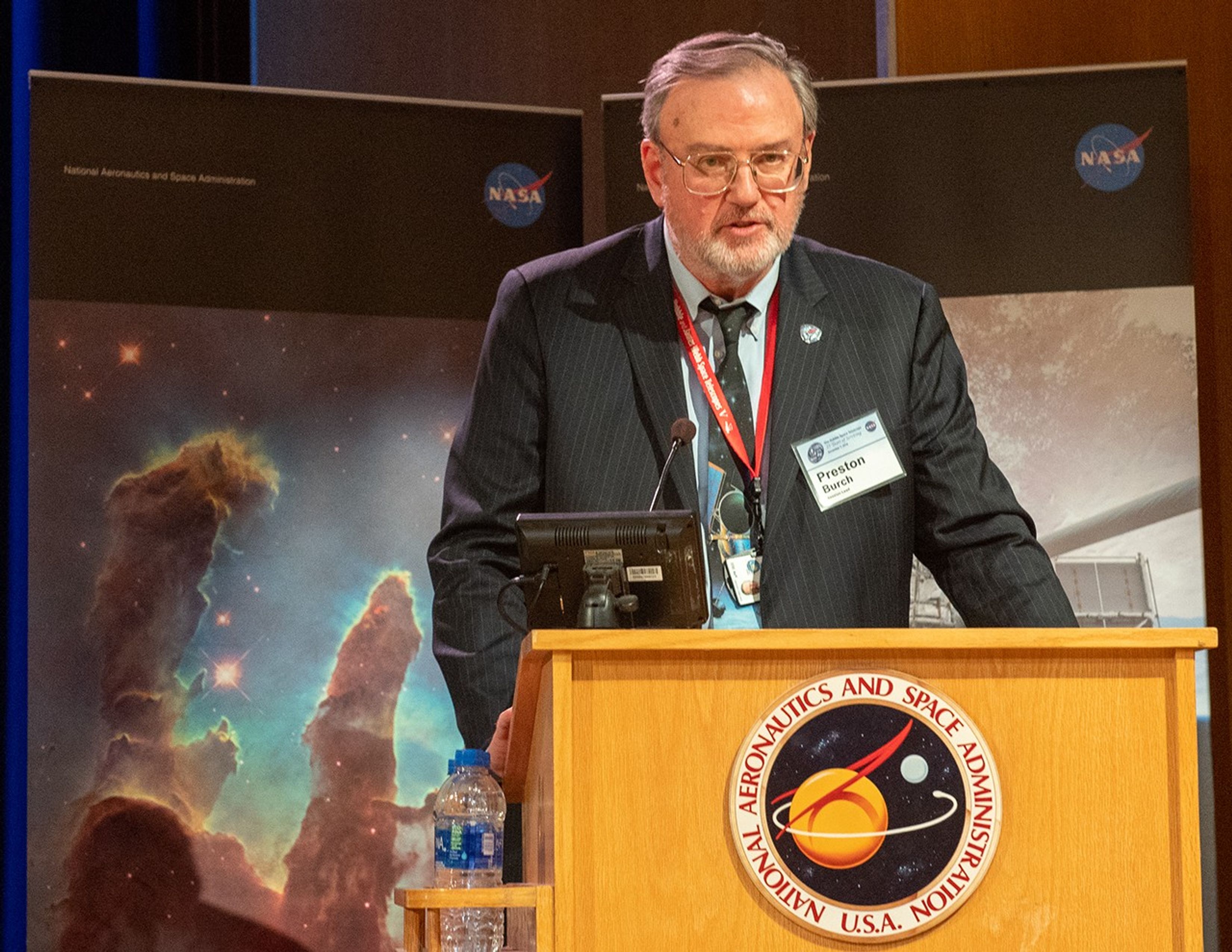 Preston Burch speaks from the NASA podium.
