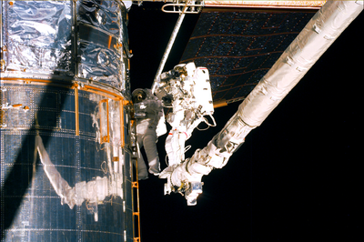 Final Spacewalk Duties Carried Out Using the RMS (1997)