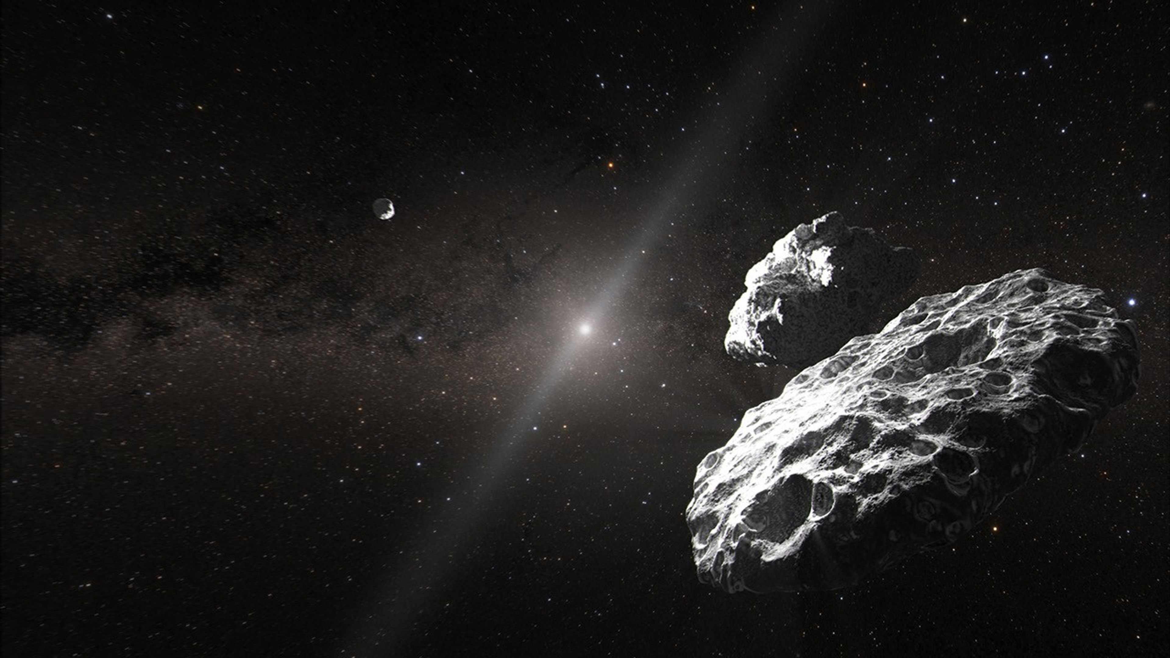 Illustration of two large, cratered rocks in the foreground right. Another rock is seen in the distance to the left. The black background of space shows the hazy Sun and zodiacal light due to dust in the solar system, as well as scattered distant stars. The words