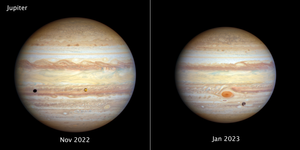 Two views of Jupiter appear side-by-side for comparison. At the top, left corner of the left image is the label Jupiter. Centered at the bottom is the label Nov 2022. The planet is banded in stripes of brownish orange, light gray, soft yellow, and shades of cream. White and cream colored ovals punctuate the planet. About one-third from the top, what appears to be a band of brownish orange, swirling waves traverses Jupiter’s face. The relatively small, variegated orange moon Io is just above the bottom third of the planet’s face and slightly right of center. Io casts a black shadow that appears at Jupiter’s far left. In the right image, centered at the bottom is the label Jan 2023. Jupiter’s Great Red Spot is the most prominent feature, centered on the bottom third of this view. The icy moon Ganymede appears as a gray, mottled orb crossing Jupiter’s face slightly below and to the right of the Great Red Spot. In this view, Jupiter is somewhat farther away, so it appears slightly smaller than on the left.