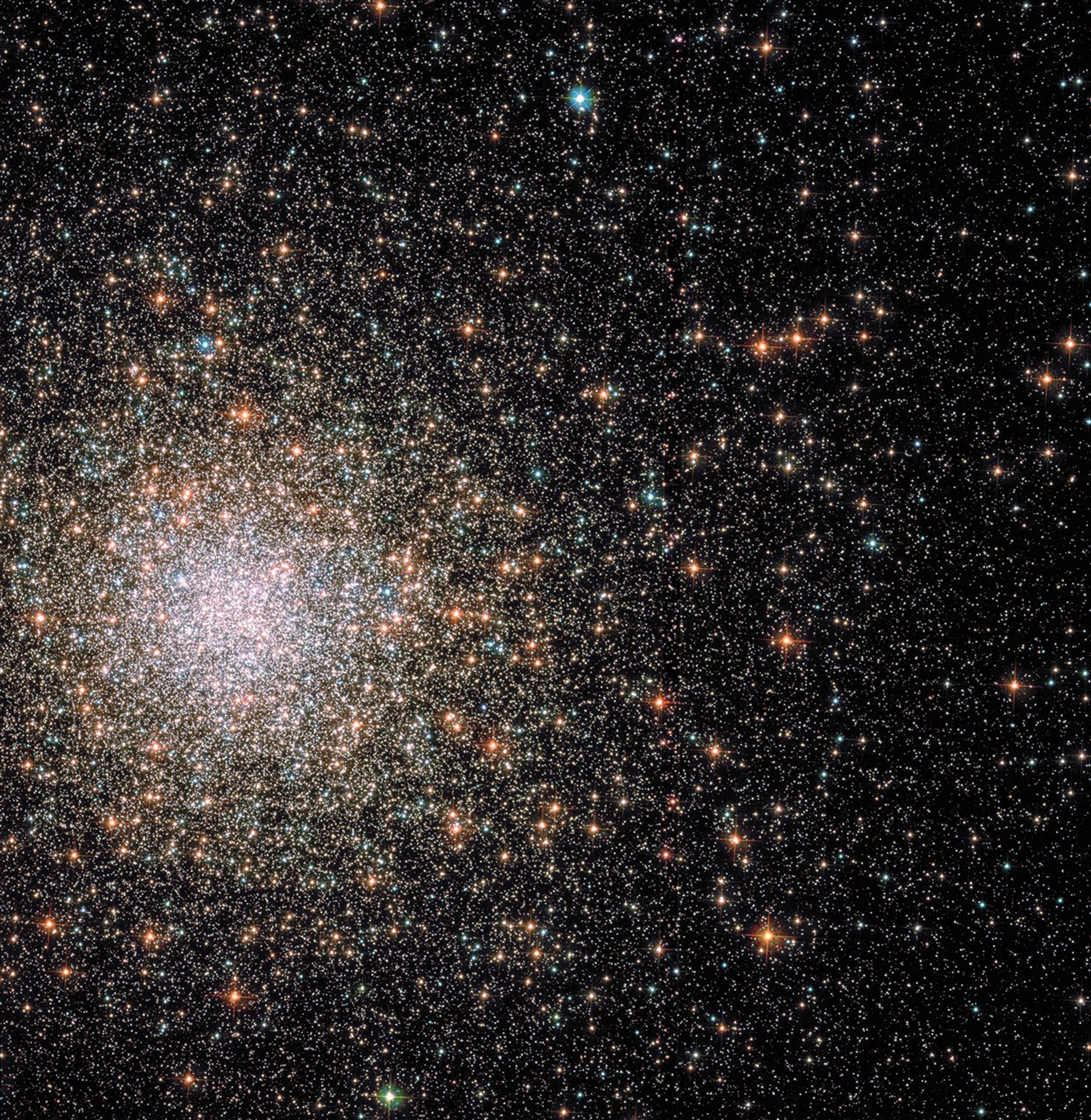 A sea of red, orange, yellow, green, blue, and white stars concentrated in the upper-left quadrant of the image.
