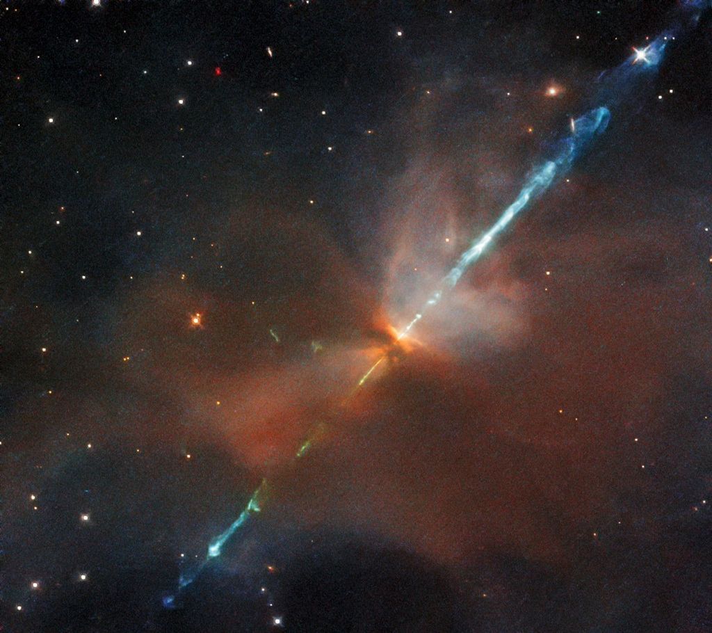 A reddish haze pierced by a diagonal blue filament, against the black backdrop of space.