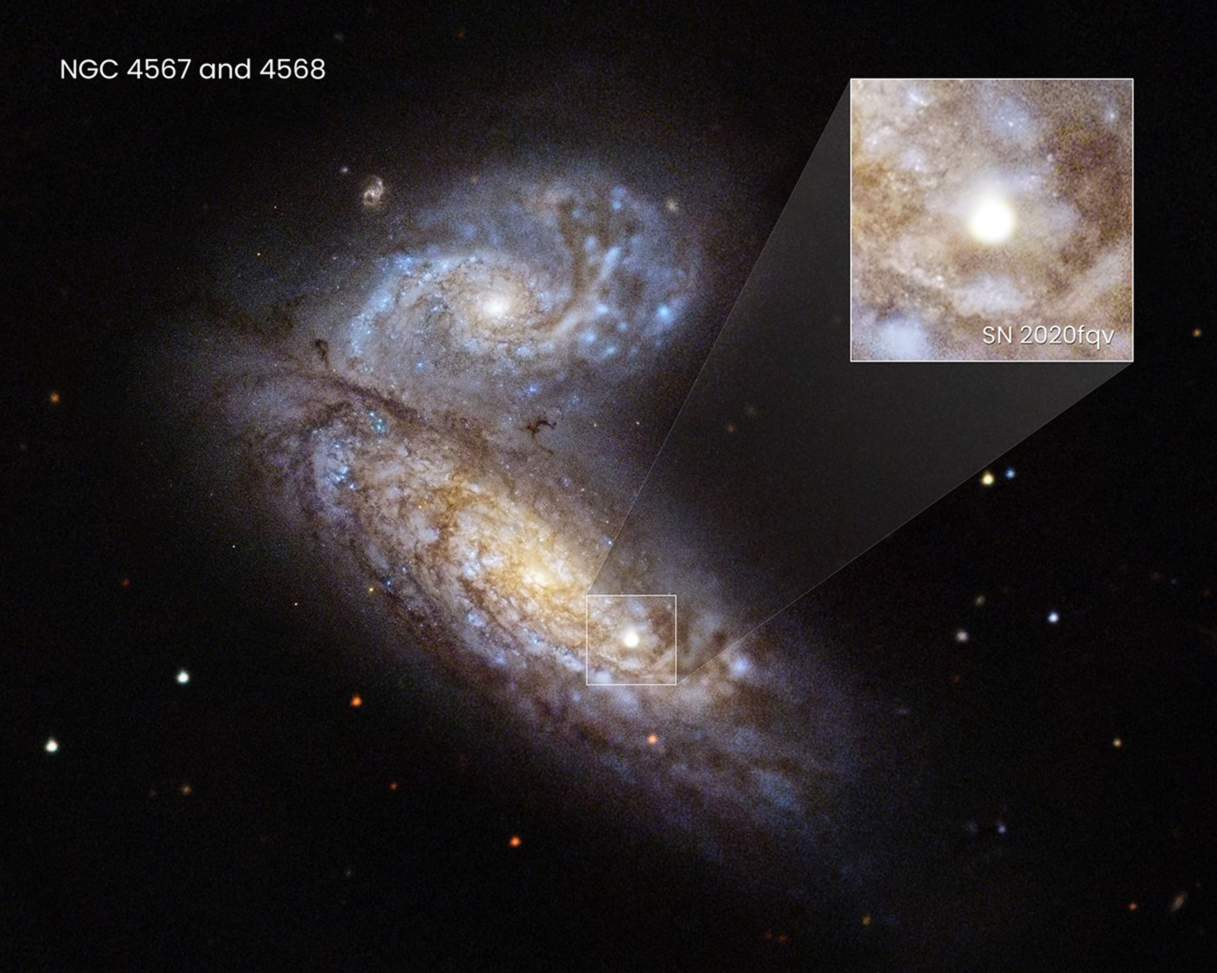 Two galaxies. A bright star in one of the galaxies has a white square around it to indicate a closer view, which is to the upper right of the galaxies.  This closer view holds stars, and glowing gas and dust with a bright-white circle at its center.