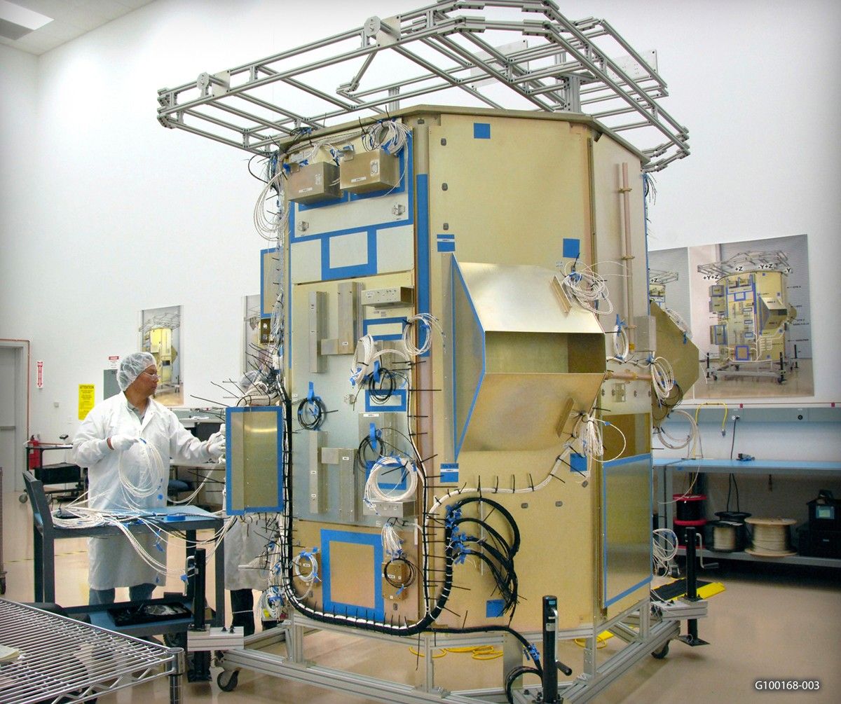 The Landsat Data Continuity Mission spacecraft mock-up at Orbital Sciences Corporation’s engineering facility. The mock-up is essentially a full scale model of the satellite, enabling engineers to check that all components seat and connect correctly.