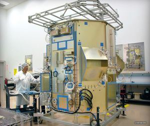The Landsat Data Continuity Mission spacecraft mock-up at Orbital Sciences Corporation’s engineering facility. The mock-up is essentially a full scale model of the satellite, enabling engineers to check that all components seat and connect correctly.
