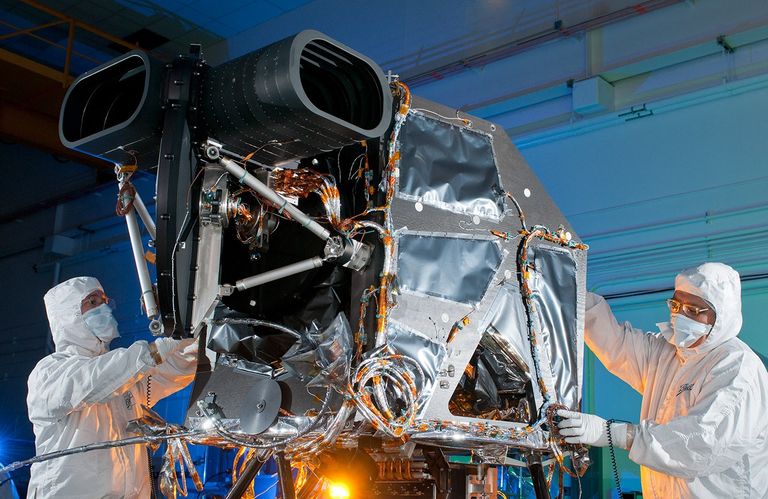 The Operational Land Imager (OLI), built by the Ball Aerospace & Technologies Corporation, will fly on the Landsat Data Continuity Mission (LDCM). OLI will measure in the visible, near infrared, and shortwave infrared portions of the spectrum, with an improved signal-to-noise ratio compared to past Landsat instruments. The opening facing the left of the photo will point at the Earth, and the opening on the right is for pointing towards the sun, to calibrate the instrument.