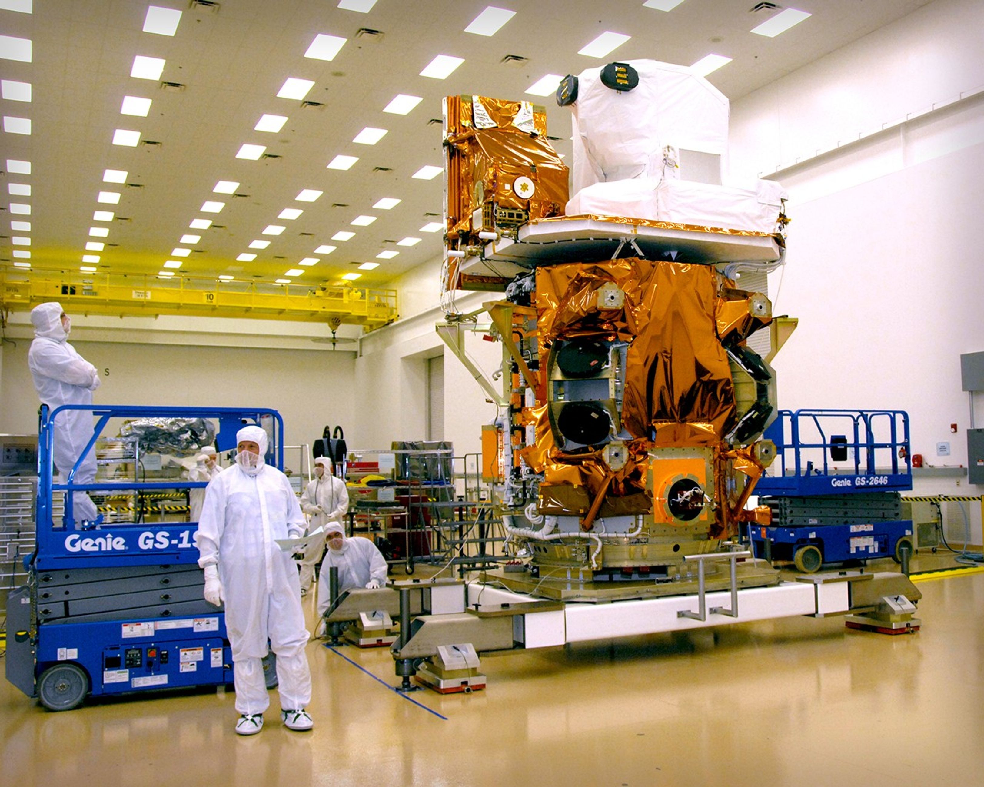 Both Landsat Data Continuity Mission (LDCM) instruments have been mounted to the spacecraft at Orbital Science Corp. in Gilbert Arizona. In this photograph the Thermal Infrared Sensor (TIRS) and the Operational Land Imager (OLI) can be seen in their payload positions on the LDCM spacecraft at the Orbital facility where the spacecraft integration is ongoing. TIRS is covered with gold-hued Multi-layer Insulation, and OLI is covered with white Tedlar insulation.