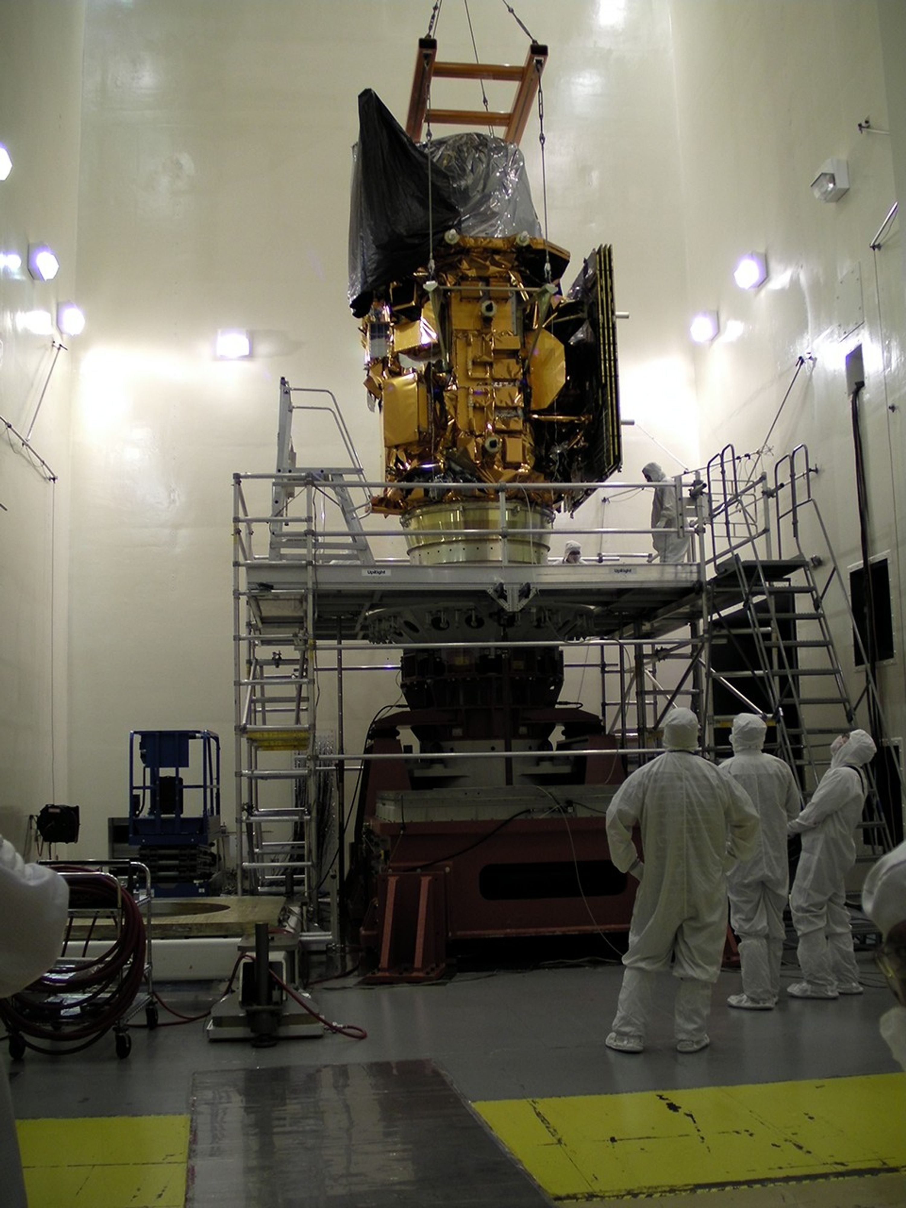Orbital Sciences Corporation recently completed Electromagnetic Interference/Capability (EMI/EMC) testing and structural dynamics testing of the Landsat Data Continuity Mission (LDCM) satellite. Pictured above, engineers at Orbital’s Satellite Manufacturing Facility in Gilbert, Ariz. place the satellite on the vibration table to perform the side-to-side X-axis vibration test to ensure the spacecraft can survive its rocket ride into space. The satellite is currently being prepared to enter thermal vacuum testing during which the satellite will be operated in a chamber that simulates the vacuum and temperature extremes of space. Thermal vacuum testing will take approximately one month to complete. The LDCM satellite is scheduled to be shipped to the launch site at Vandenberg Air Force Base in California in December. Once launched in early 2013, it will be known as Landsat 8 and will continue the rich legacy of previous Landsat satellites that have collected images of the Earth’s global land surface to benefit society in numerous ways including: agriculture and forest monitoring, water resource management, and land use change assessment.