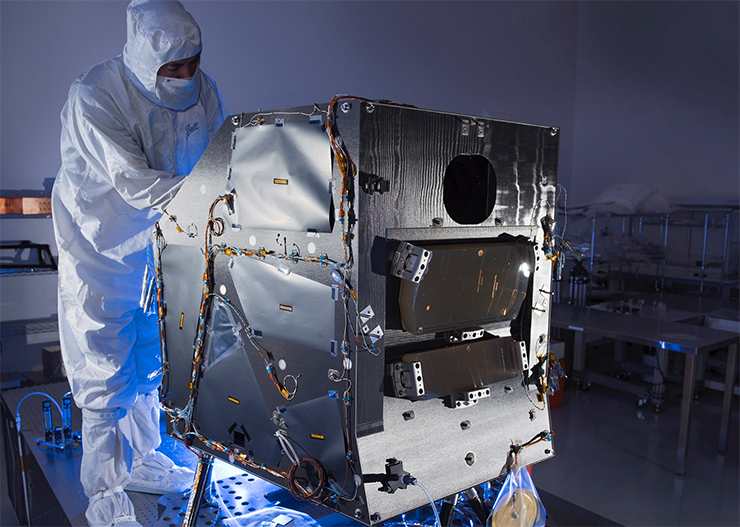 Following the successful Landsat 9 Preliminary Design Review held at NASA’s Goddard Space Flight Center from Sept. 12-15, Ball Aerospace & Technologies Corporation released the above photo of the Operational Land Imager 2 (OLI-2).  OLI-2 will fly aboard Landsat 9 taking measurements in the visible, near infrared, and shortwave infrared portions of the electromagnetic spectrum. The spatial resolution of its images will be 15 m (49 ft) for the panchromatic band and 30 m (98 ft) for the multispectral bands. The image swath will be 185 km (115 mi) wide, covering wide areas of the Earth’s landscape while providing sufficient resolution to distinguish land cover features like urban centers, farms, and forests.  The OLI-2 design is a copy of Landsat 8’s OLI. The OLI-2 instrument will include an optical telescope, Focal Plane Array / Focal Plane Electronics (FPA/FPE), calibration hardware, and instrument support electronics.  OLI-2 is being built by Ball Aerospace in Boulder, Colorado.