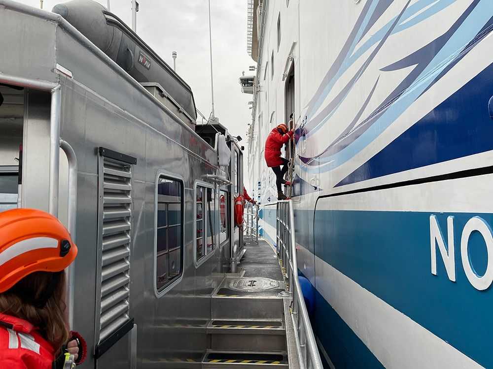 NPS ranger boards a cruise ship in Glacier Bay