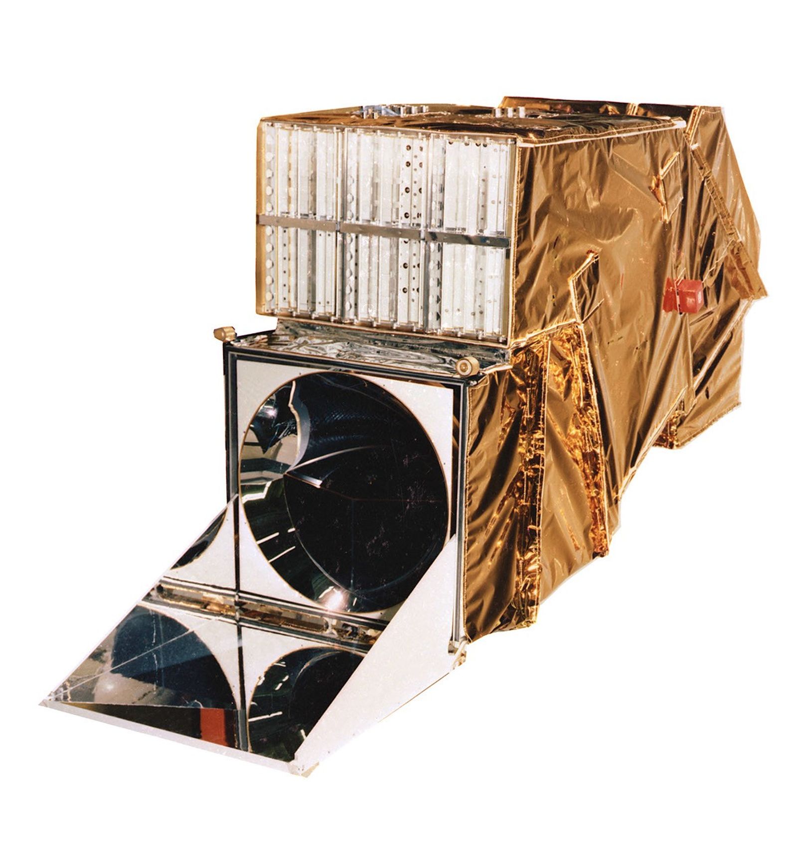 Physical model of the Thematic Mapper instrument showing its gold thermal blanket covering, mirror assembly, and internal detector components used for imaging the Earth.