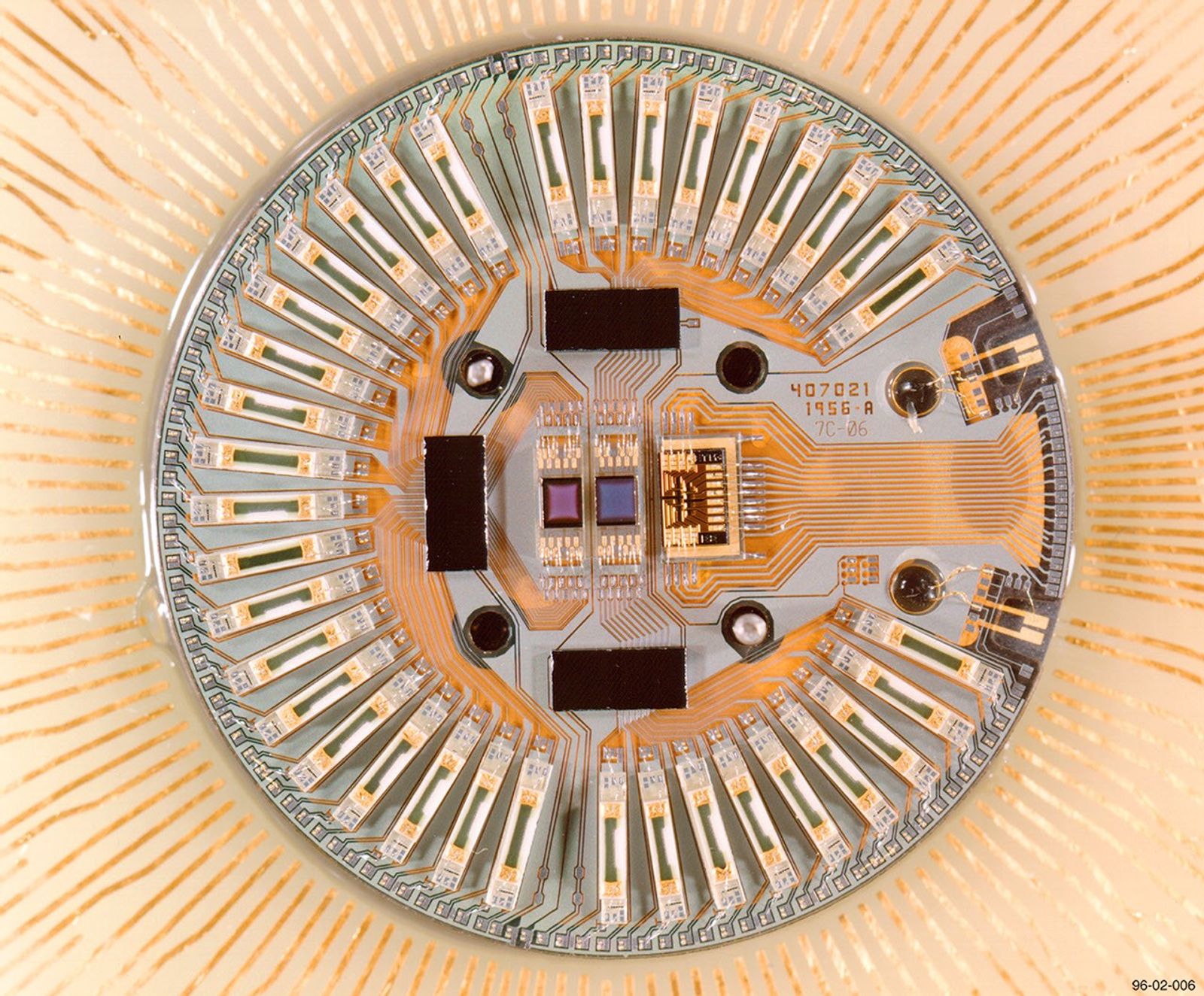 Landsat 7's Cold Focal Plane Array (CFPA) showing the intricate wire bonding and sensor elements used for thermal infrared detection and Earth observation imaging.