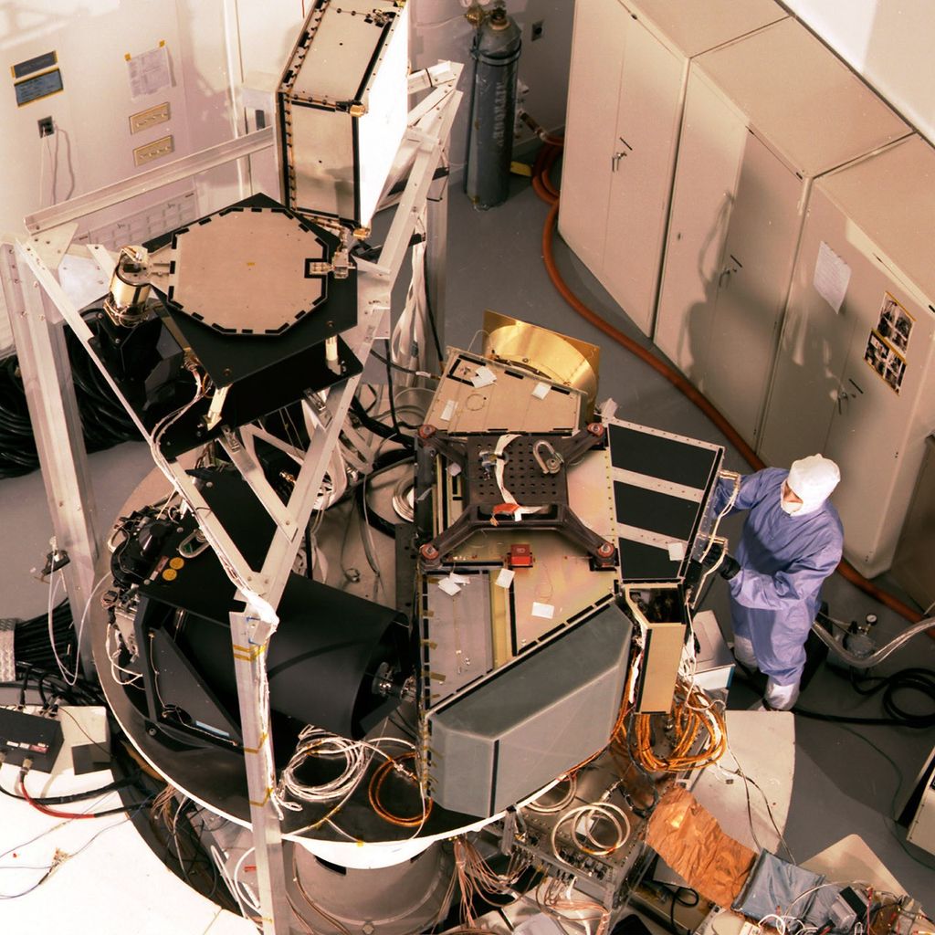 Landsat 7 satellite during testing operations in a high bay cleanroom facility.