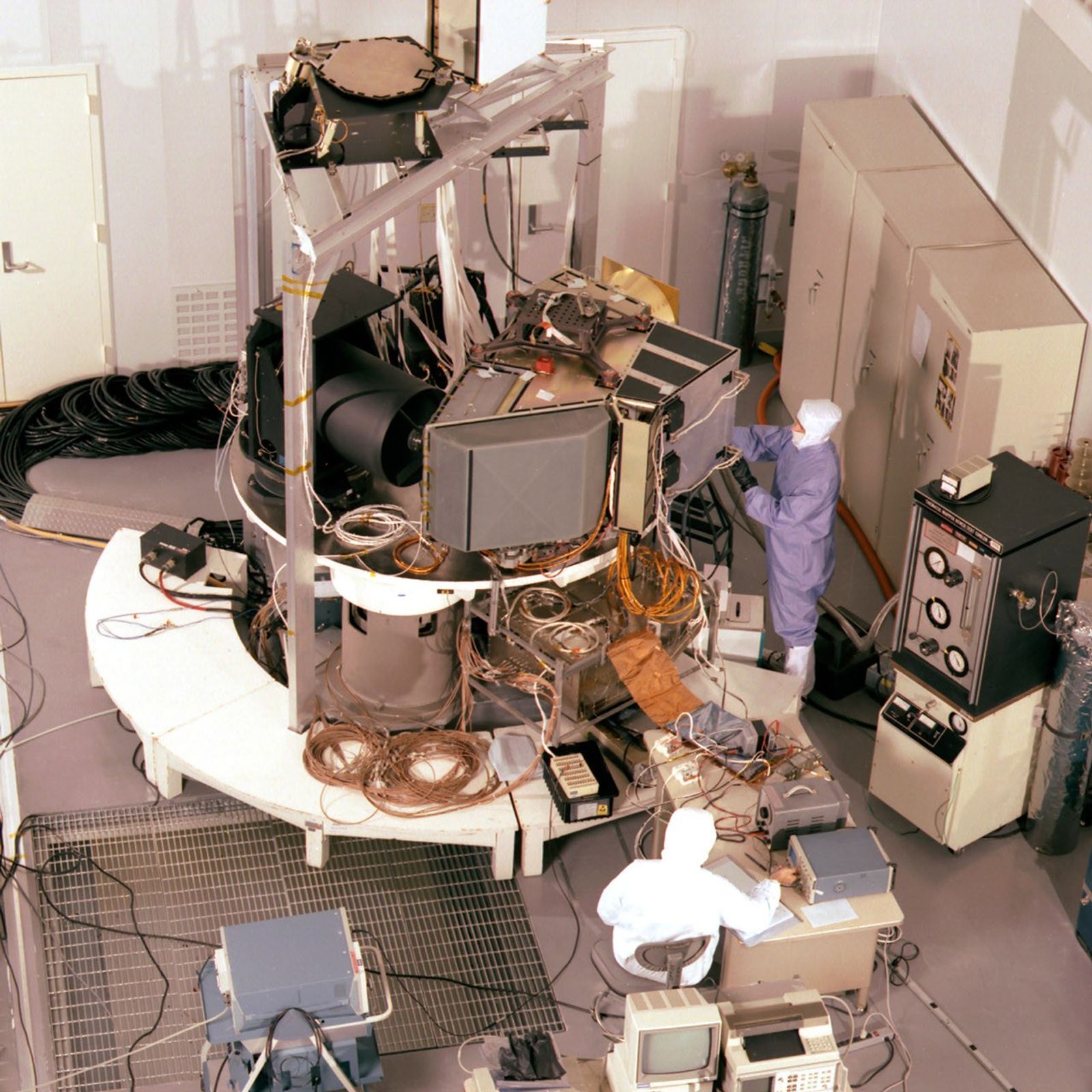 Landsat 7 satellite during testing operations in a high bay cleanroom facility.