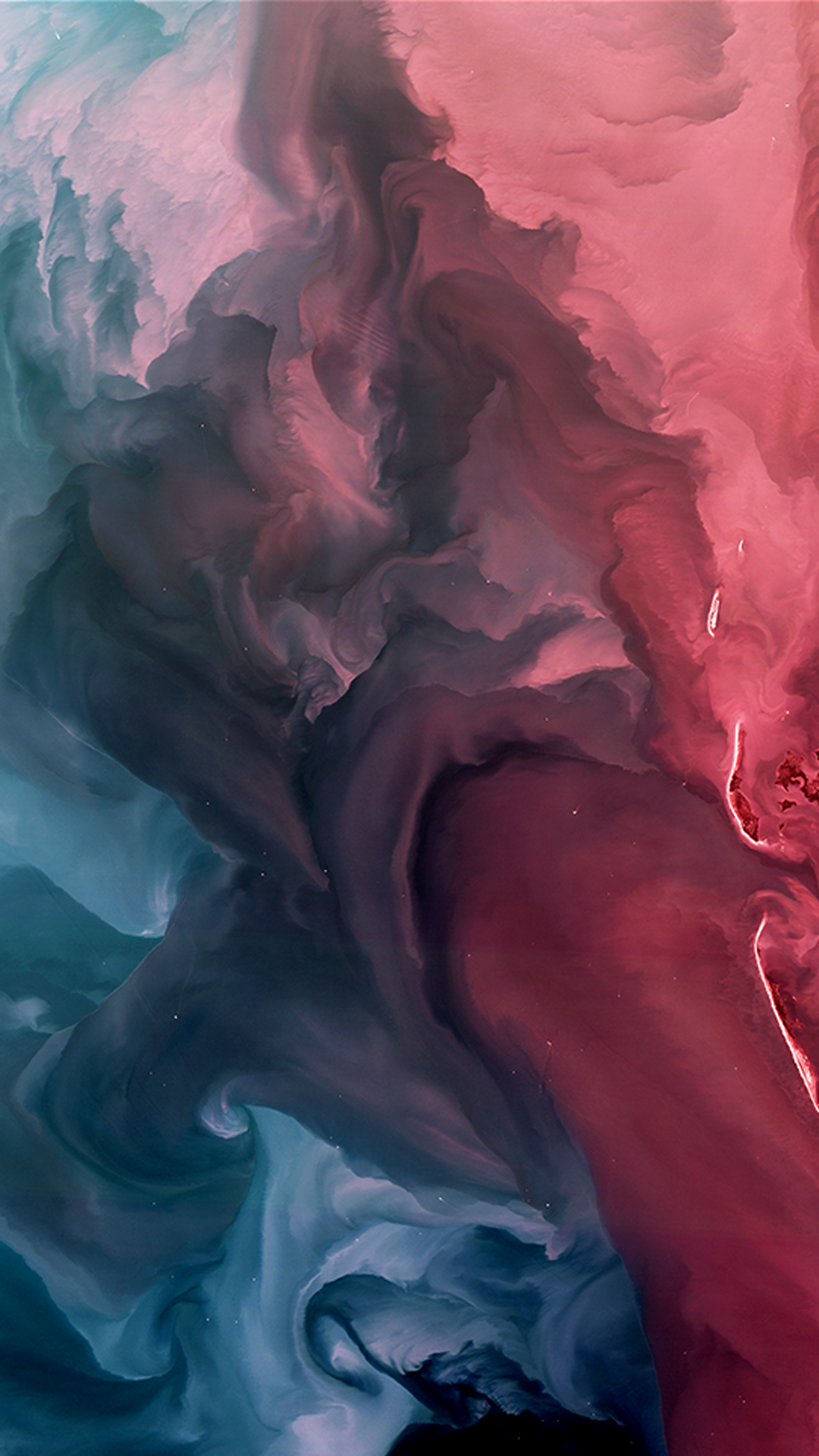 A Landsat image of red, blue, and purple swirls of phytoplankton