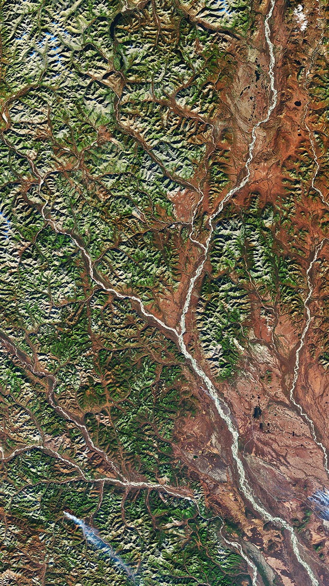 A natural-color satellite image of the Dzhugdzhur Mountains.
