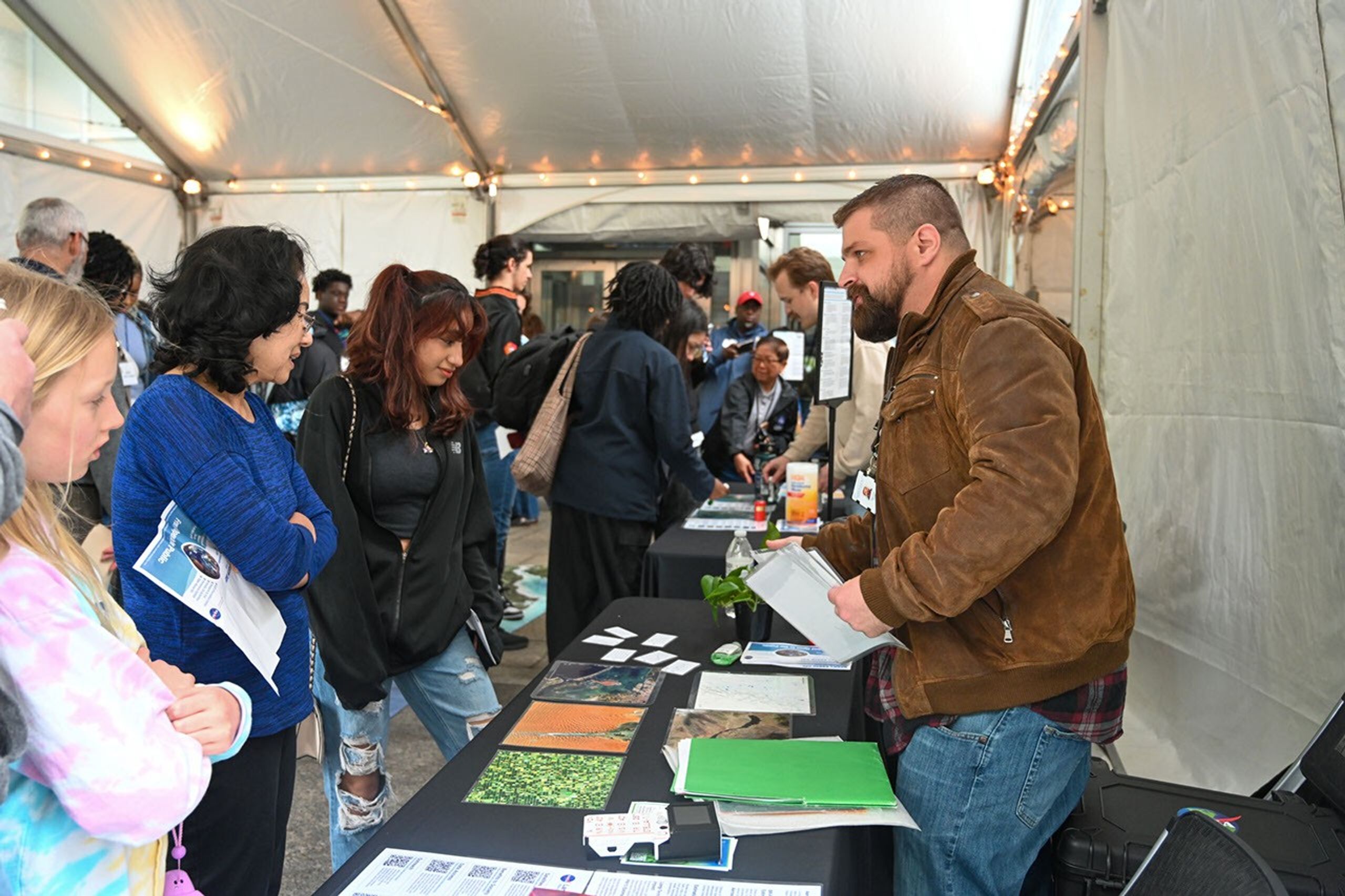 Michael Taylor discusses Landsat and spectral signatures to a student group.