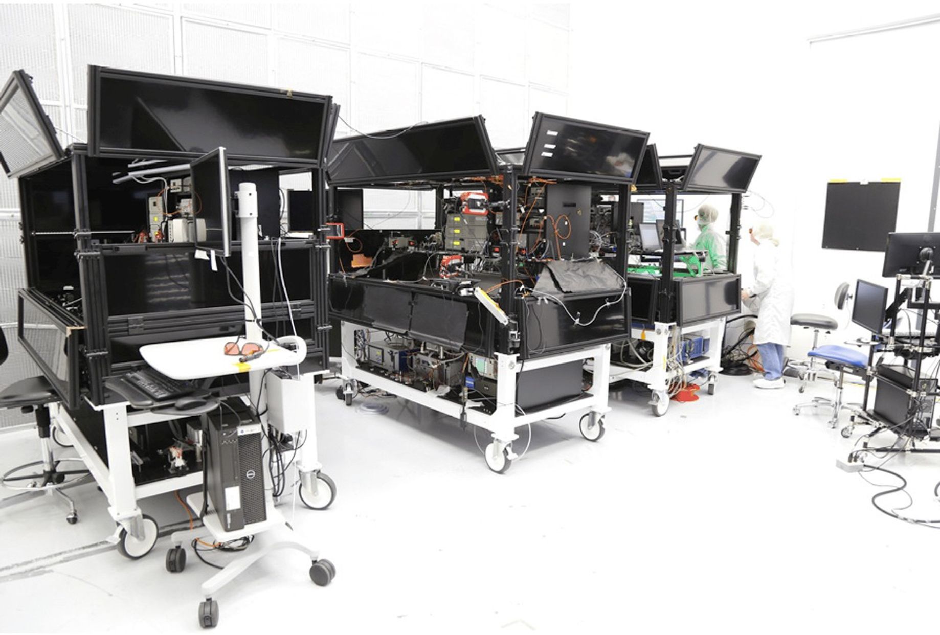 GLAMR laser tables, three black carts with laser instrumentation on top.