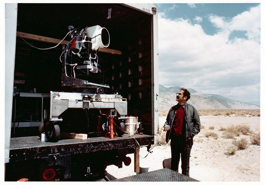 The MSS engineering model on the back of a truck with a man standing on the ground to the right.