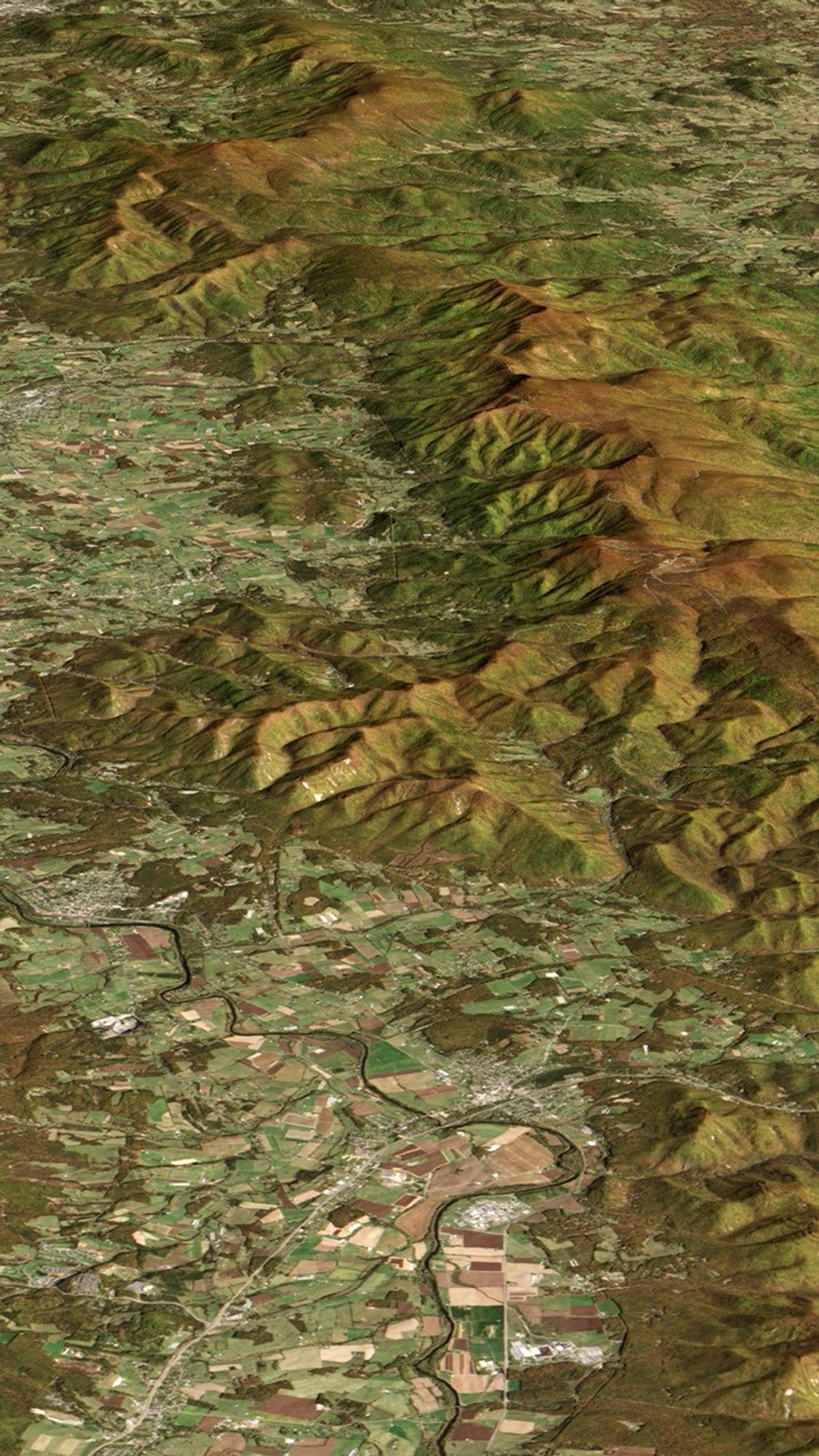 Natural-color Landsat 8 image of ridges near Shenandoah National Park in Virginia, acquired on October 21, 2013. The image has been draped over a digital elevation model based on data from the Advanced Spaceborne Thermal Emission and Reflection Radiometer (ASTER) on NASA�s Terra satellite. The tops of both ridges are brown because fall colors had emerged in these cool, high-elevation areas.