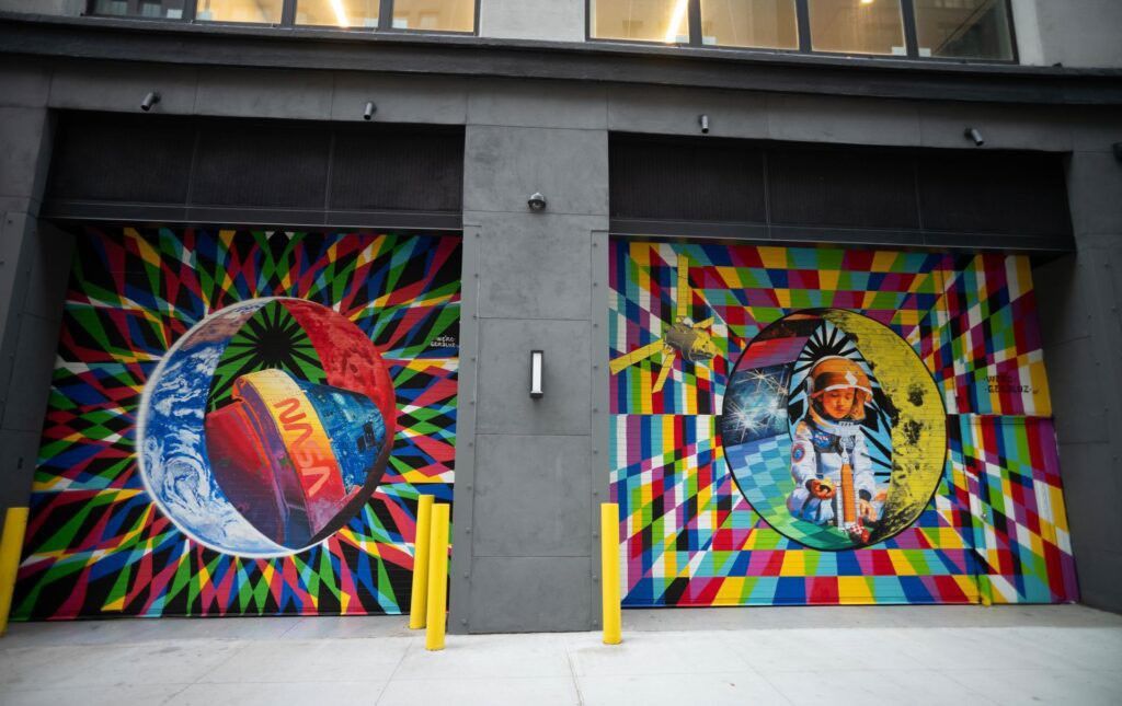 The inaugural murals for the relaunched NASA Art Program appear side-by-side at 350 Hudson Street, Monday, Sept. 23, 2024, in New York City. The murals, titled “To the Moon, and Back,” were created by New York-based artist team Geraluz and WERC and use geometrical patterns to invite deeper reflection on the exploration, creativity, and connection with the cosmos. NASA/Joel Kowsky