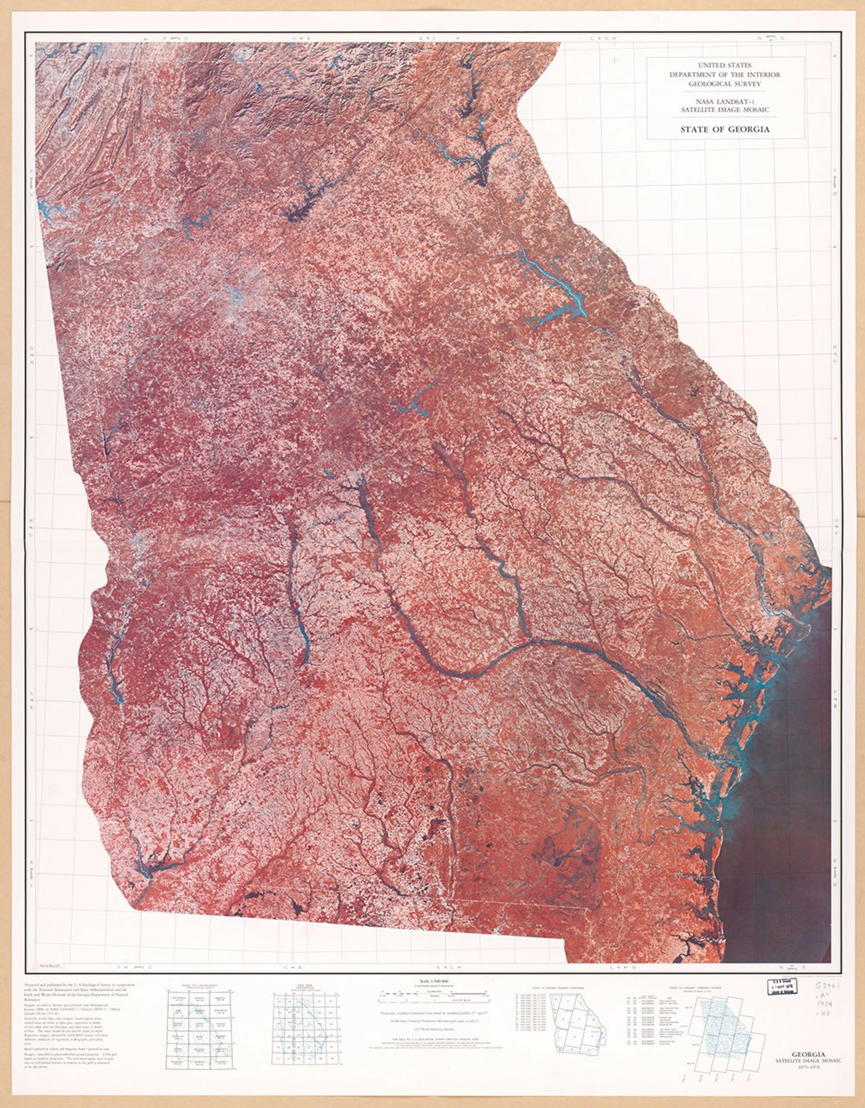 A false-color satellite image mosaic of the entire state of Georgia, created from LANDSAT-1 data collected in 1973-74. The state appears in reddish-pink tones with blue waterways, including major rivers and the Atlantic coastline visible on the right side. The image clearly shows the state's geographic features, from the Appalachian mountains in the north to the coastal plains in the south.