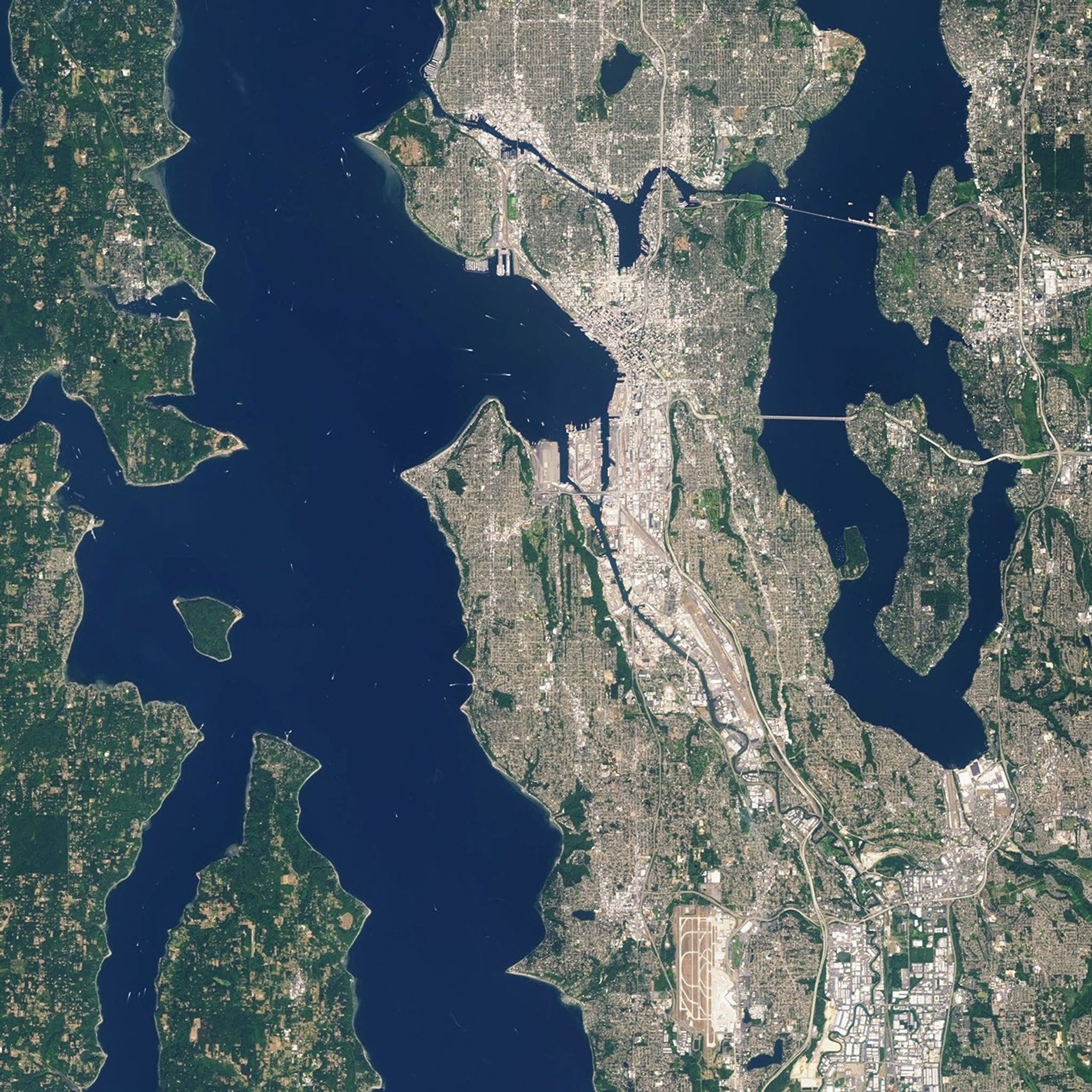 Landsat 7 image of Seattle, Washington acquired August 23, 2014.  Landsat 7 is a U.S. satellite used to acquire remotely sensed images of the Earth's land surface and surrounding coastal regions. It is maintained by the Landsat 7 Project Science Office at the NASA Goddard Space Flight Center in Greenbelt, MD.  Landsat satellites have been acquiring images of the Earth’s land surface since 1972. Currently there are more than 2 million Landsat images in the National Satellite Land Remote Sensing Data Archive.