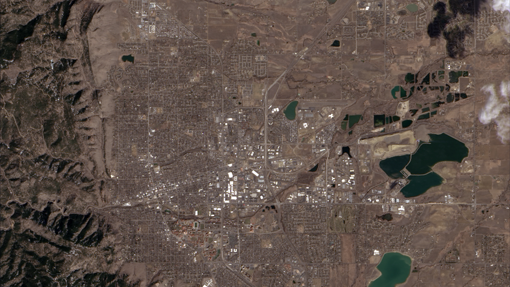 Landsat 8’s first light satellite image, acquired on March 18, 2013, shows Boulder, Colorado surrounded by tree-covered mountains and dormant plains.