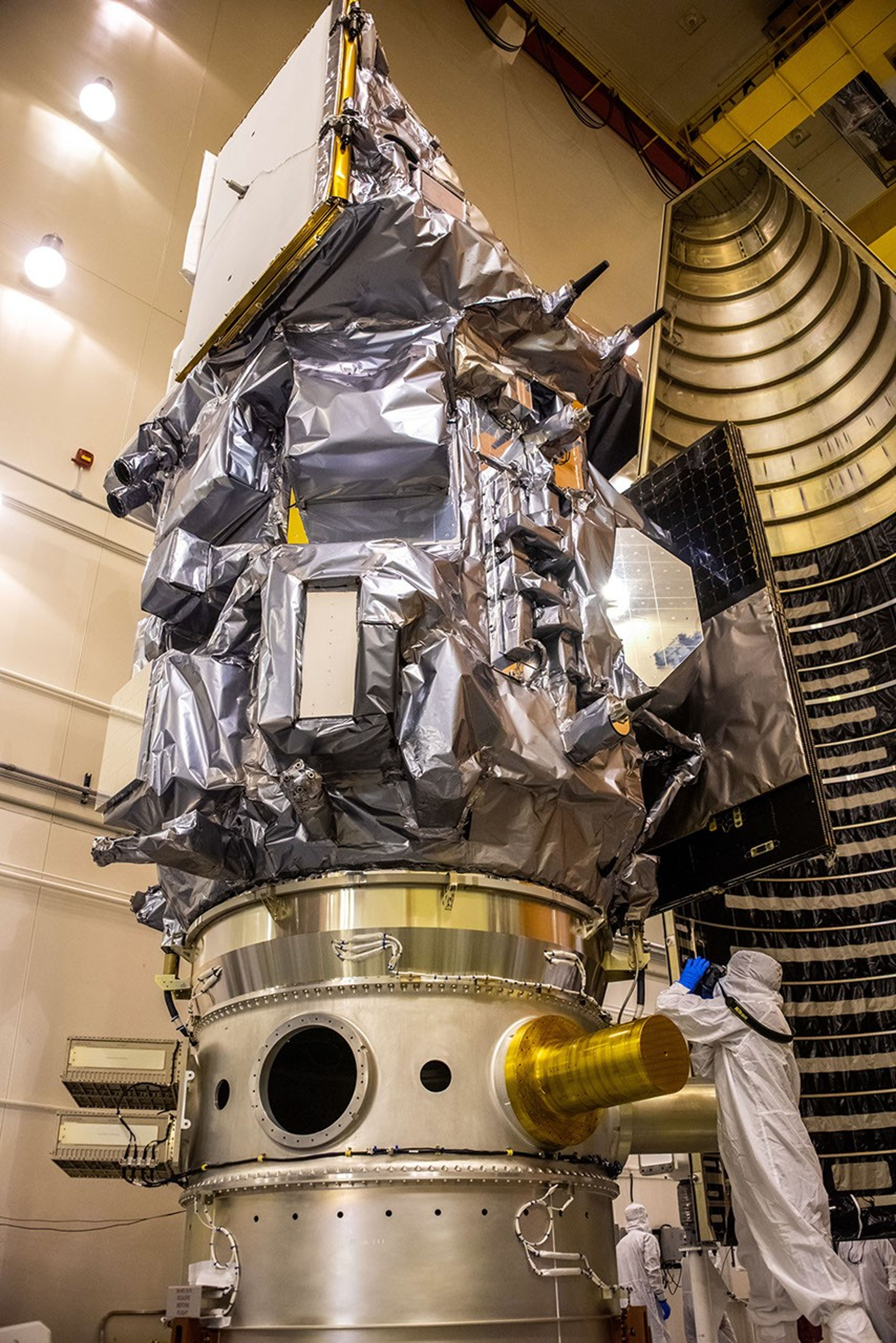 Inside the Integrated Processing Facility at Vandenberg Space Force Base in California, the Landsat 9 spacecraft is moved into position for encapsulation on Aug. 16, 2021. The two halves of the United Launch Alliance (ULA) payload fairing will surround and encase Landsat 9 to protect it during launch atop the ULA Atlas V rocket. Landsat 9 will launch on the Atlas V rocket from Space Launch Complex 3 at Vandenberg in September 2021. The launch is being managed by NASA’s Launch Services Program based at Kennedy Space Center, America’s multi-user spaceport. The Landsat 9 satellite will continue the nearly 50-year legacy of previous Landsat missions. It will monitor key natural and economic resources from orbit. Landsat 9 is managed by the agency’s Goddard Space Flight Center in Greenbelt, Maryland. The satellite will carry two instruments: the Operational Land Imager 2, which collects images of Earth’s landscapes in visible, near infrared and shortwave infrared light, and the Thermal Infrared Sensor 2, which measures the temperature of land surfaces. Like its predecessors, Landsat 9 is a joint mission between NASA and the U.S. Geological Survey.