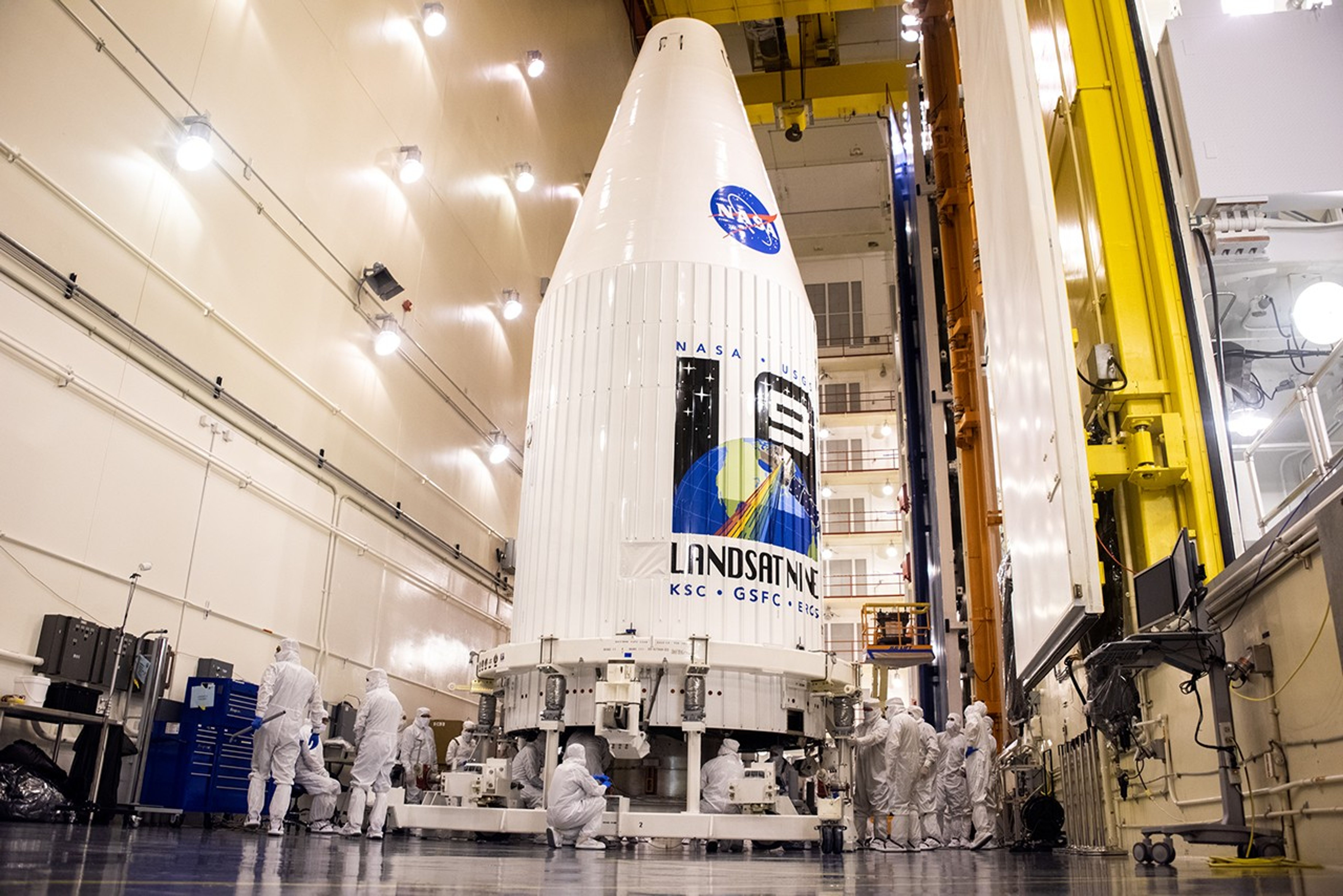Inside the Integrated Processing Facility at Vandenberg Space Force Base in California, both United Launch Alliance (ULA) payload fairings are secured around the Landsat 9 spacecraft on Aug. 16, 2021. The fairings will encase and protect Landsat 9 during launch atop the ULA Atlas V rocket. Landsat 9 will launch on the Atlas V rocket from Space Launch Complex 3 at Vandenberg in September 2021. The launch is being managed by NASA’s Launch Services Program based at Kennedy Space Center, America’s multi-user spaceport. The Landsat 9 satellite will continue the nearly 50-year legacy of previous Landsat missions. It will monitor key natural and economic resources from orbit. Landsat 9 is managed by the agency’s Goddard Space Flight Center in Greenbelt, Maryland. The satellite will carry two instruments: the Operational Land Imager 2, which collects images of Earth’s landscapes in visible, near infrared and shortwave infrared light, and the Thermal Infrared Sensor 2, which measures the temperature of land surfaces. Like its predecessors, Landsat 9 is a joint mission between NASA and the U.S. Geological Survey.