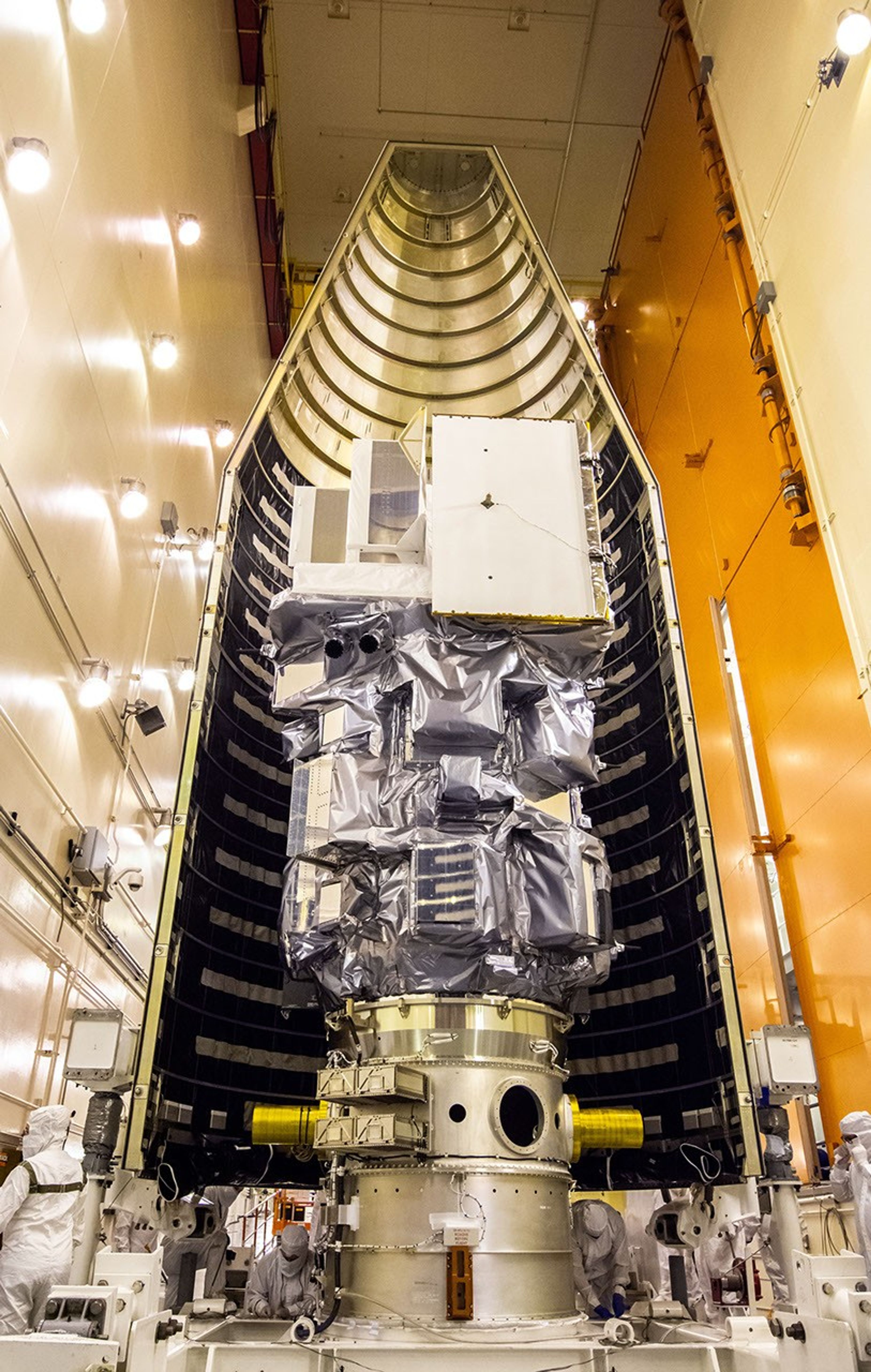 Inside the Integrated Processing Facility at Vandenberg Space Force Base in California, the Landsat 9 spacecraft is moved into position for encapsulation on Aug. 16, 2021. The two halves of the United Launch Alliance (ULA) payload fairing will surround and encase Landsat 9 to protect it during launch atop the ULA Atlas V rocket. Landsat 9 will launch on the Atlas V rocket from Space Launch Complex 3 at Vandenberg in September 2021. The launch is being managed by NASA’s Launch Services Program based at Kennedy Space Center, America’s multi-user spaceport. The Landsat 9 satellite will continue the nearly 50-year legacy of previous Landsat missions. It will monitor key natural and economic resources from orbit. Landsat 9 is managed by the agency’s Goddard Space Flight Center in Greenbelt, Maryland. The satellite will carry two instruments: the Operational Land Imager 2, which collects images of Earth’s landscapes in visible, near infrared and shortwave infrared light, and the Thermal Infrared Sensor 2, which measures the temperature of land surfaces. Like its predecessors, Landsat 9 is a joint mission between NASA and the U.S. Geological Survey.