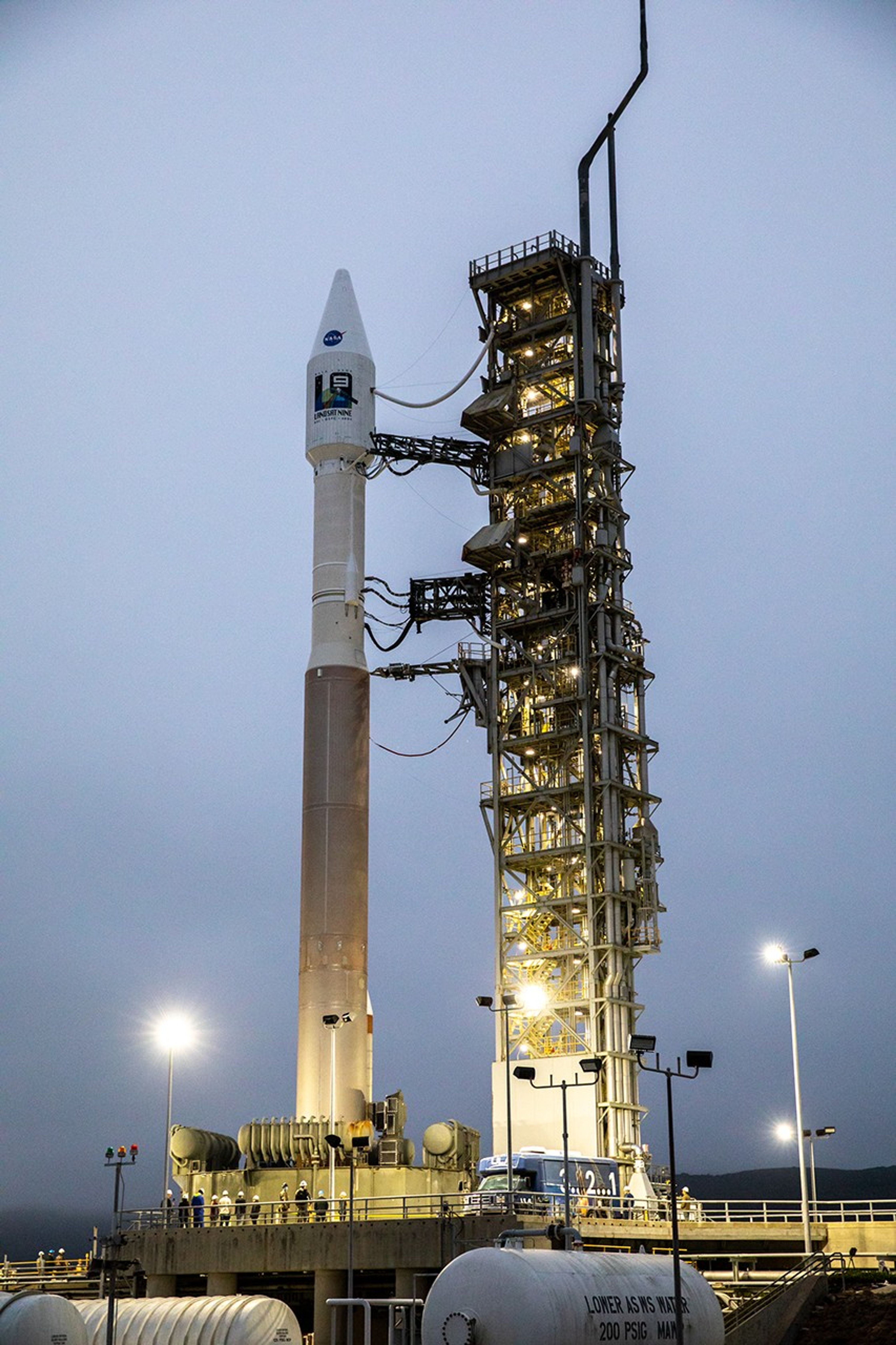 The United Launch Alliance Atlas V 401 rocket with NASA’s Landsat 9 satellite is secured on the launch pad at Space Launch Complex 3 (SLC-3) at Vandenberg Space Force Base in California, on Sept. 27, 2021, after making the trek from the Vertical Integration Facility. Landsat 9 is scheduled to launch at 2:12 p.m. EDT (11:12 a.m. PDT) today, Sept. 27, atop the Atlas V from SLC-3. The launch is managed by NASA’s Launch Services Program based at Kennedy Space Center. The Landsat 9 satellite will continue the nearly 50-year legacy of previous Landsat missions. It will join its sister satellite, Landsat 8, in orbit to monitor key natural and economic resources from orbit. Landsat 9 is managed by the agency’s Goddard Space Flight Center in Greenbelt, Maryland. The satellite will carry two instruments: the Operational Land Imager 2, which collects images of Earth’s landscapes in visible, near infrared and shortwave infrared light, and the Thermal Infrared Sensor 2, which measures the temperature of land surfaces. Like its predecessors, Landsat 9 is a joint mission between NASA and the U.S. Geological Survey.