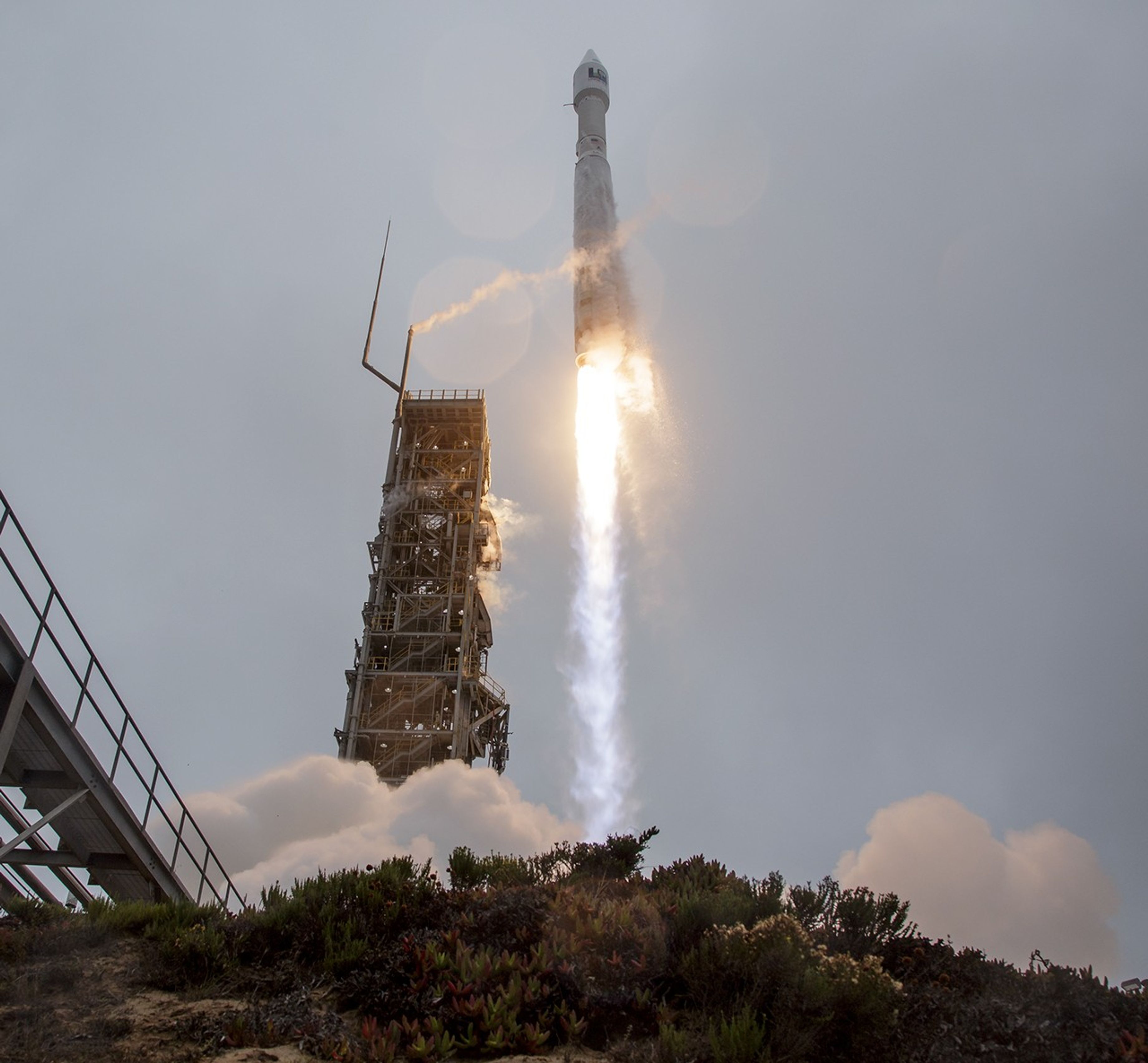 The United Launch Alliance (ULA) Atlas V rocket with the Landsat 9 satellite onboard launches, Monday, Sept. 27, 2021, from Space Launch Complex 3 at Vandenberg Space Force Base in California. The Landsat 9 satellite is a joint NASA/U.S. Geological Survey mission that will continue the legacy of monitoring Earth’s land and coastal regions.