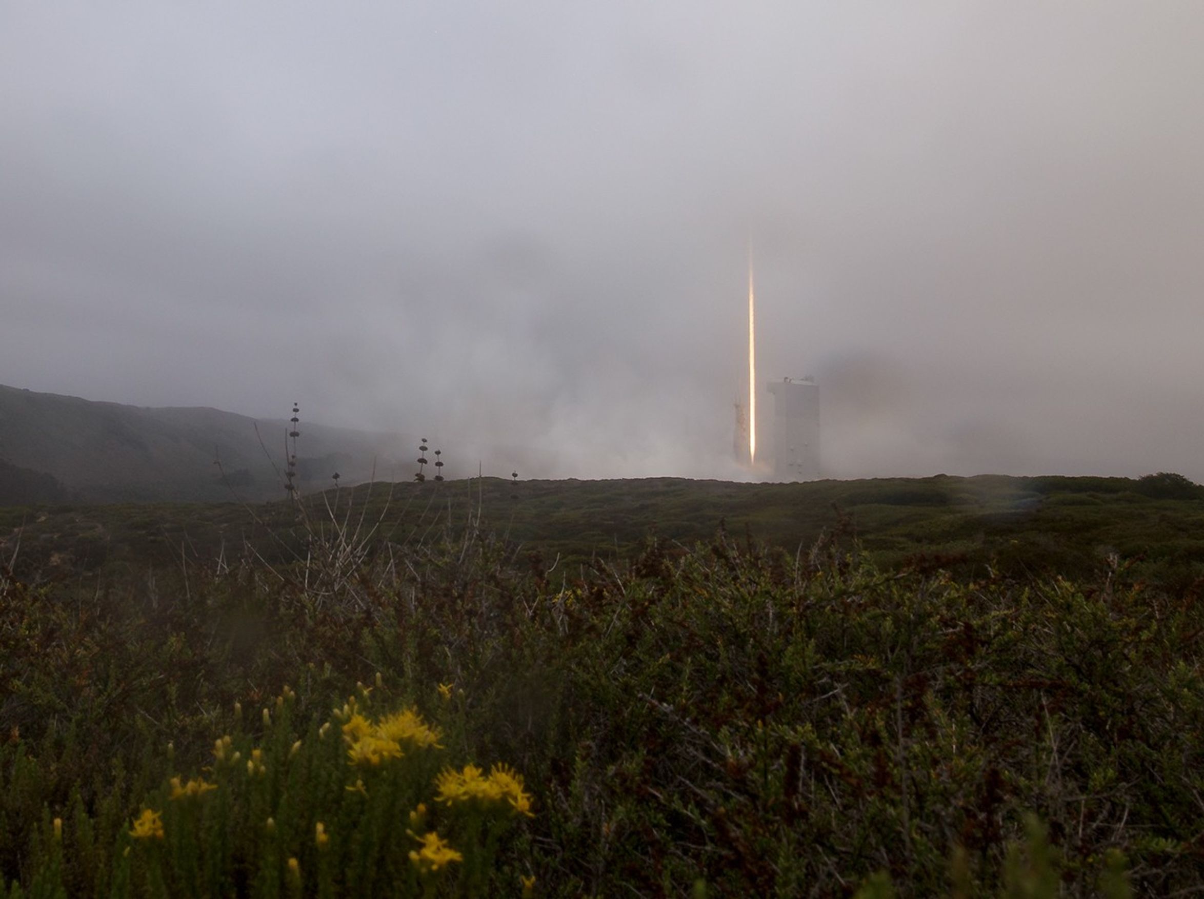The United Launch Alliance (ULA) Atlas V rocket with the Landsat 9 satellite onboard is seen in this 30 second exposure as is launches, Monday, Sept. 27, 2021, from Space Launch Complex 3 at Vandenberg Space Force Base in California. The Landsat 9 satellite is a joint NASA/U.S. Geological Survey mission that will continue the legacy of monitoring Earth’s land and coastal regions.