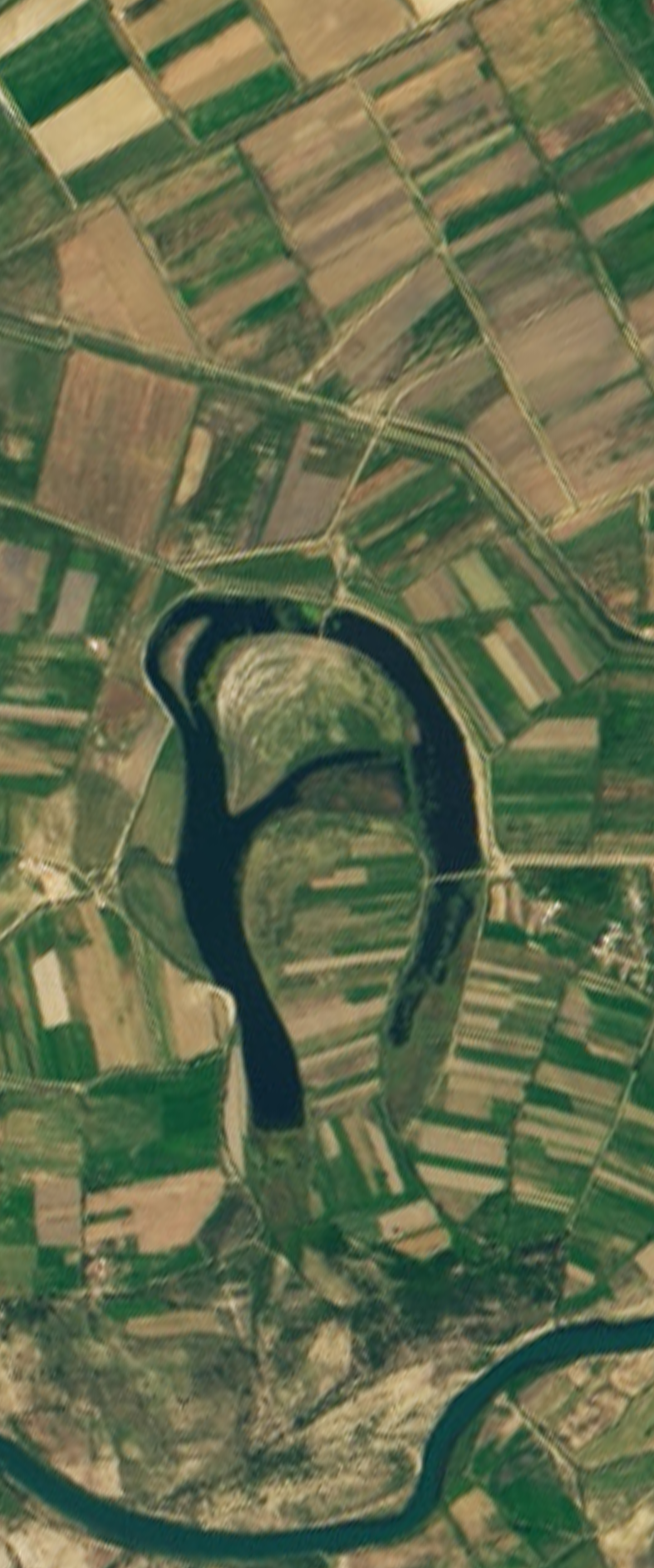 Landsat satellite image shows a river forming a capital letter A.