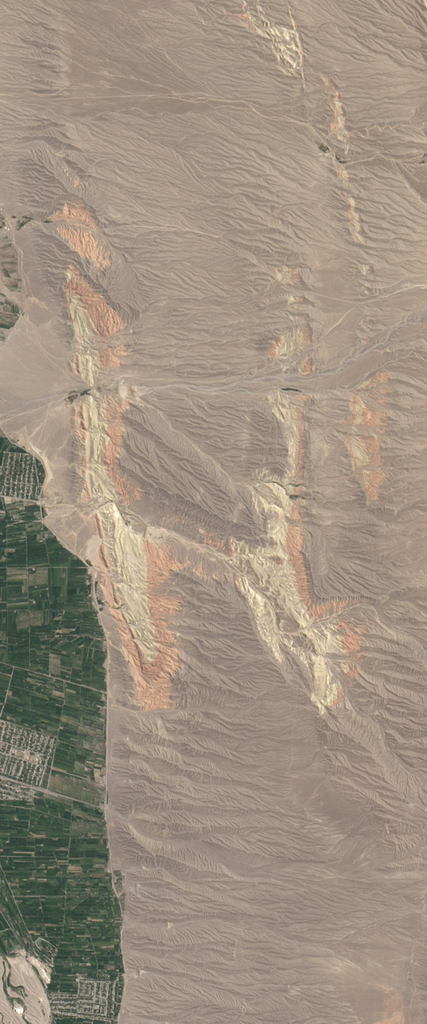 Landsat satellite image of a dry mountainous region with two layers or colors forms the upper case letter H.