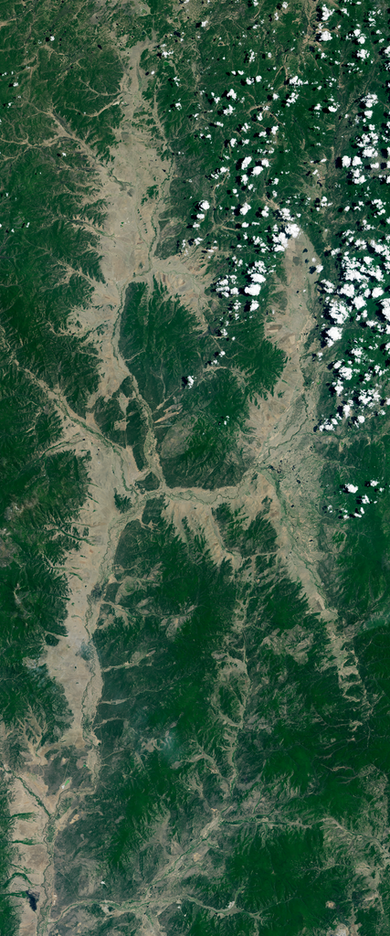Landsat satellite image of dry land surrounded by vegetation forms the capital letter H.