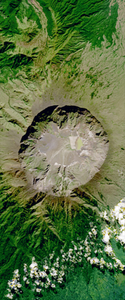 Mountaintop volcanic crater forms the capital letter Q in this Landsat satellite image.